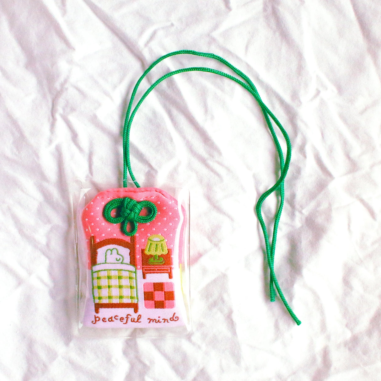 2x2.5 omamori charm with a 8 inch string.
An omamori is a Japanese charm that provides protection and luck!