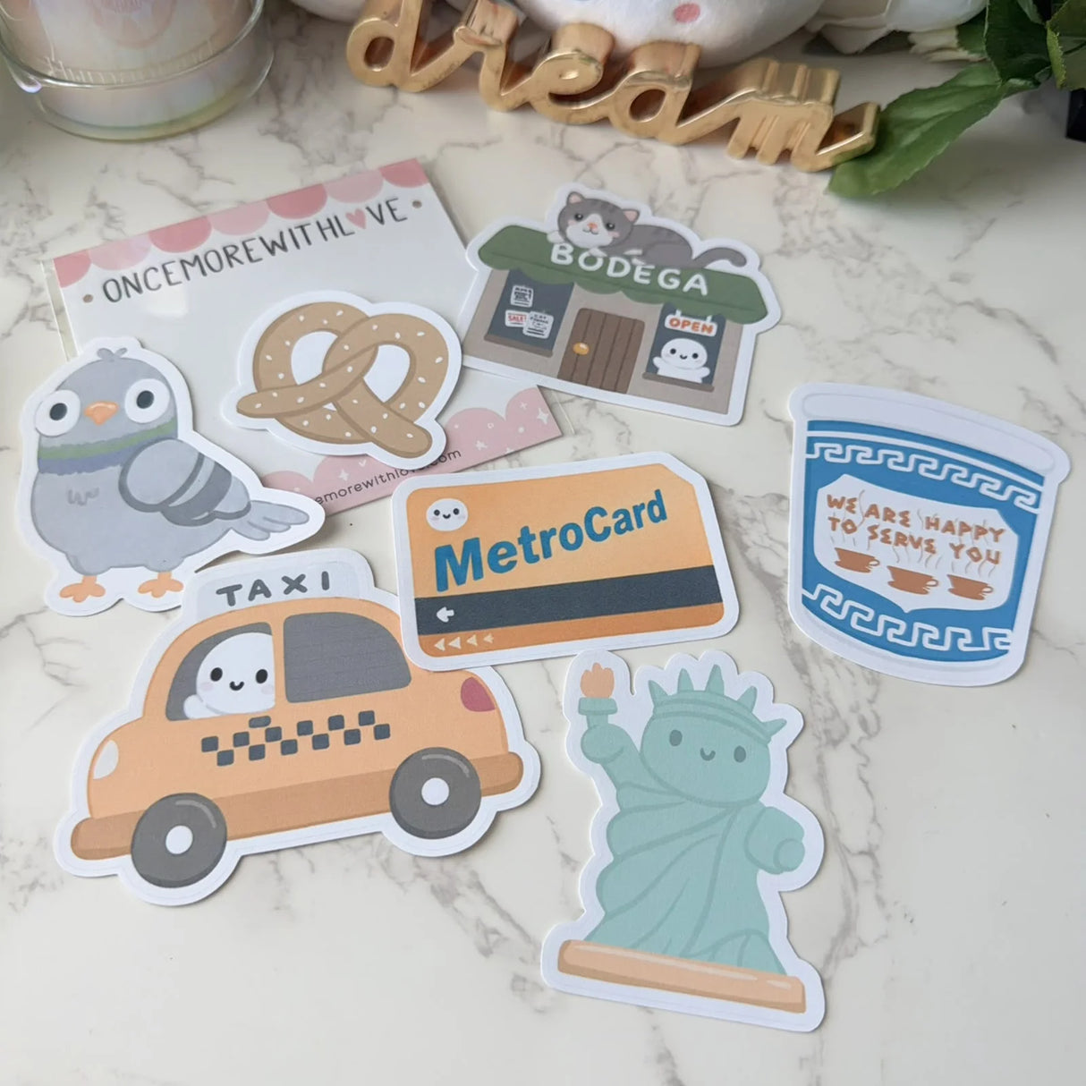 Bring the charm, energy, and personality of New York City to your planner, journal, or craft projects with the Once More With Love Sticker Pack – New York. This adorable vinyl sticker set features expressive characters and city‑themed designs that add a fun, whimsical touch to any creative spread.
Includes 7 Stickers