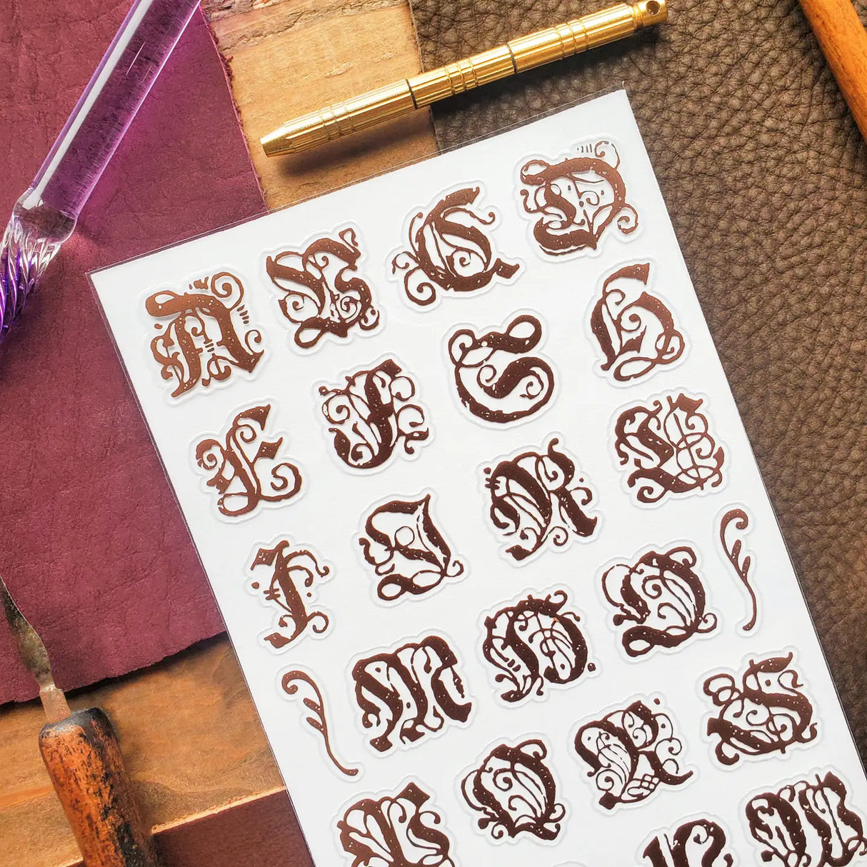 STICKII - Ornate Alphabet Sticker Sheet
✒️📜 Add a touch of old-world elegance to your pages with this ornate alphabet sheet. Inspired by gothic lettering, vintage monograms, and illuminated manuscript details, each letter is full of curling flourishes and antique charm. Perfect for spelling out initials, decorating journal pages, labeling letters, or giving any paper project the feeling of something pulled from a beautifully aged book.
Top Coating: None
Adhesive Layer: Paper
Backing Layer: Paper
6.69" x