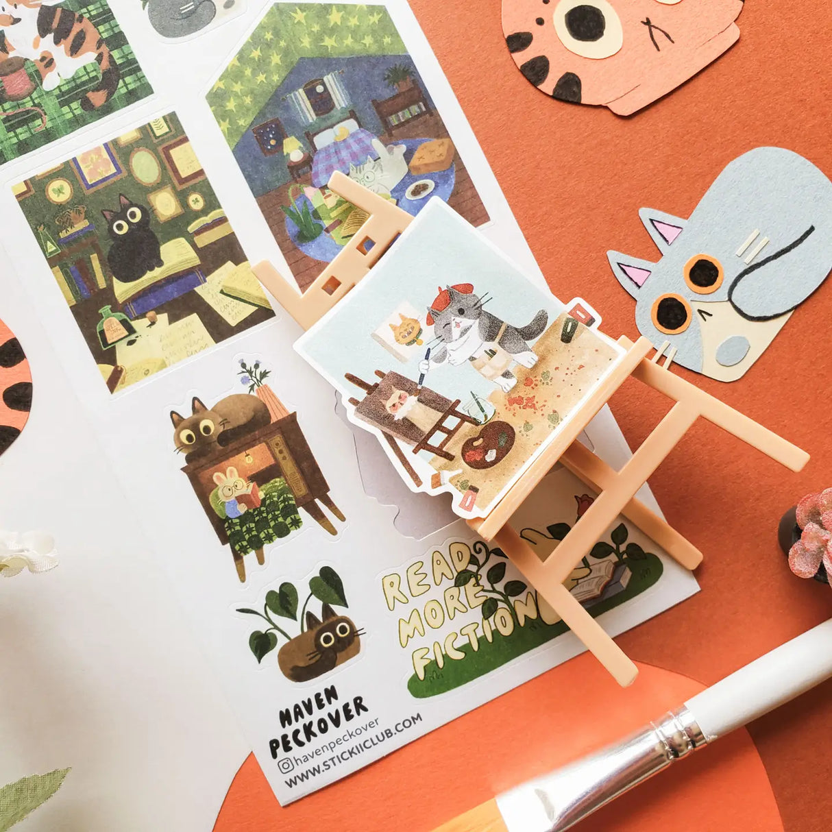 📚🐈 Tucked between cozy rooms, leafy corners, and pages waiting to be explored, @havenpeckover’s curious cats are keeping very busy! These creative kitties paint portraits, curl up with books, play with yarn, tend to their plants, and settle in for quiet study sessions with tea and cookies. A charming little sheet for anyone who believes work is better with a cat nearby, and play is basically required between chapters.
Art by: @havenpeckover