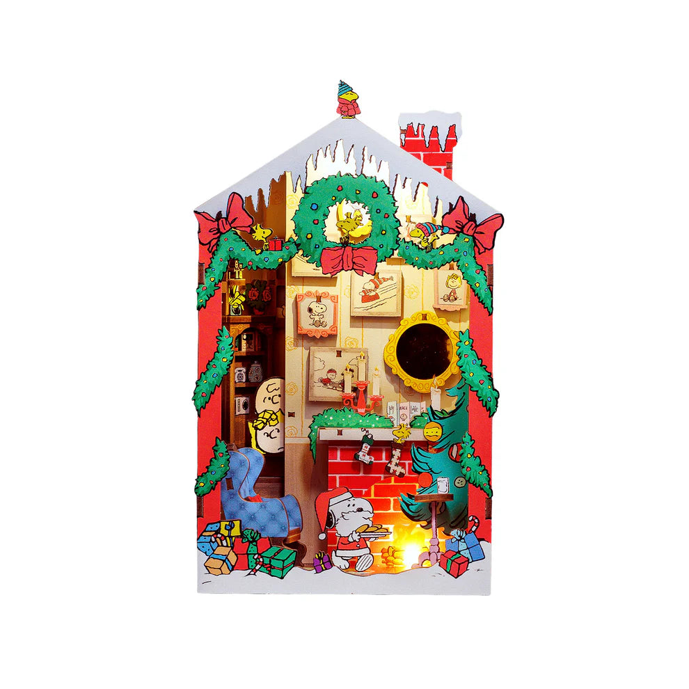 Snoopy Santa surprise! Bring the magic of the holidays to your bookshelf with this charming DIY book nook kit featuring Snoopy dressed as Santa! Caught cookie-handed, Snoopy steals the show while Charlie Brown and Sally peek from the stairs in festive wonder. With delightful details and nostalgic cheer, this cozy scene is perfect for Peanuts fans and holiday decorators alike.