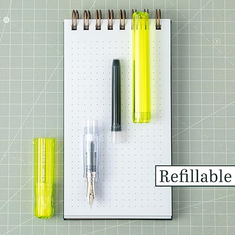 Kakuno is a delightful, new fountain pen that is ideal for both first time fountain pen users and experienced writers. Everyone can enjoy writing with a Kakuno fountain pen. "Kakuno" means "to write" in Japanese, and that's just what this pen helps users to do by featuring an appealing smiley face on the nib, when oriented upward, ensures perfect nib orientation. The NEW Kakuno Clear body features the Extra Fine, Fine and Medium Nib (with a tongue sticking out). Indentations in the cap make it easy to grasp