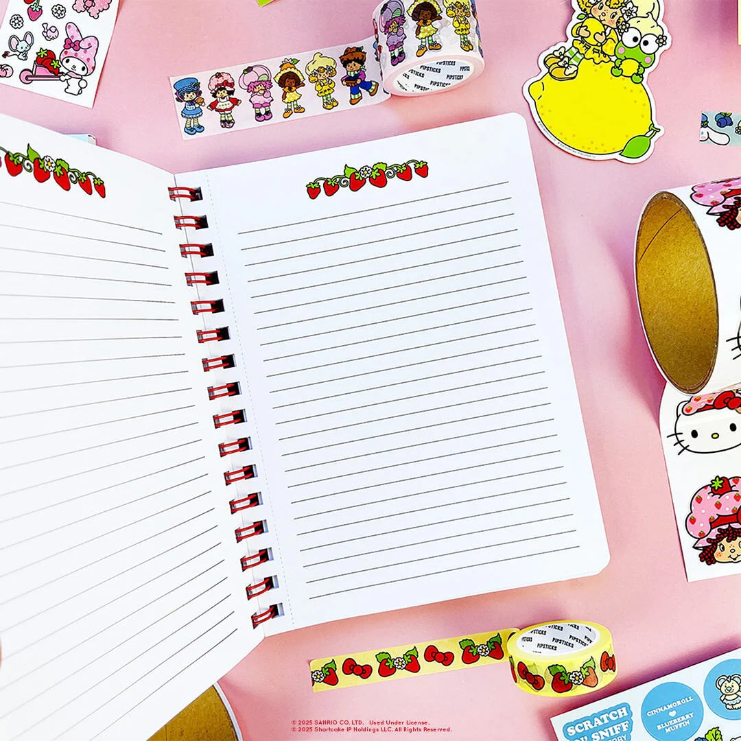 A tiny notebook with major main character energy 🍓💌 Covered in the sweetest strawberry + Hello Kitty details, it’s perfect for quick notes, doodles, and lists you’ll actually want to write. Small enough to toss anywhere, cute enough to show off everywhere.
A bright red spiral notebook featuring Hello Kitty sitting in a strawberry, framed with a white scalloped oval and tiny floral details 🍓 The smooth cover pops with bold color, while inside you’ll find lined pages with coordinating strawberry accents a