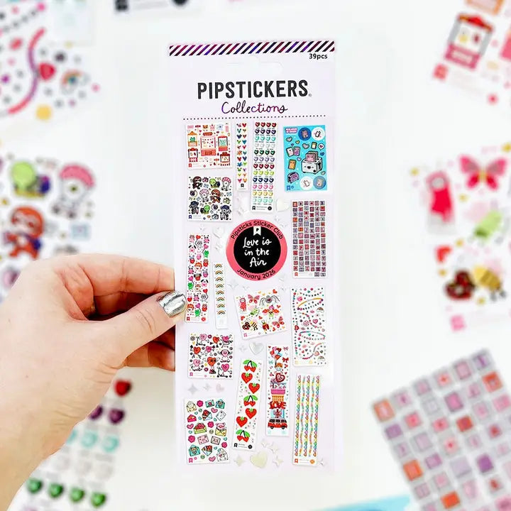 LIMITED EDITION COLLECTIBLE!
PipStickers are the PERFECT gift for the sticker lover in your life - even if it's you! These unique PVC designs with holographic silver foil accents come on a clear backing and cannot be found anywhere else.
Includes one 3" x 7" sheet of Kids Collections Vol 1: Love is in the Air PipStickers and includes the Pipsticks manifesto.