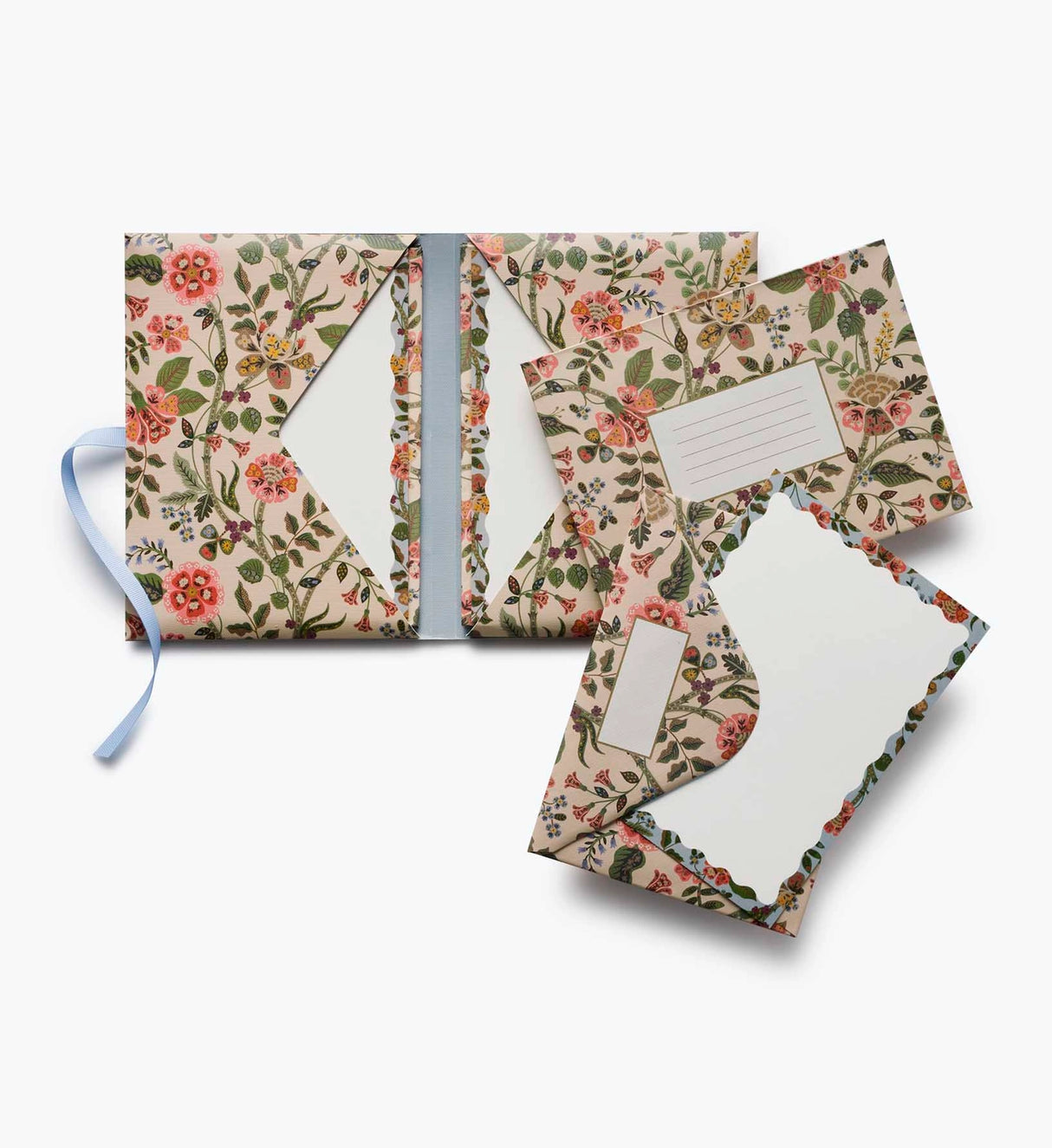 A prettier stationery stash, perfect for writing on the go. Printed with Gracie florals in three elegant colorways, this folio-style set includes 12 notecards with matching envelopes, tucked inside a coordinating folder with a ribbon-tie closure.