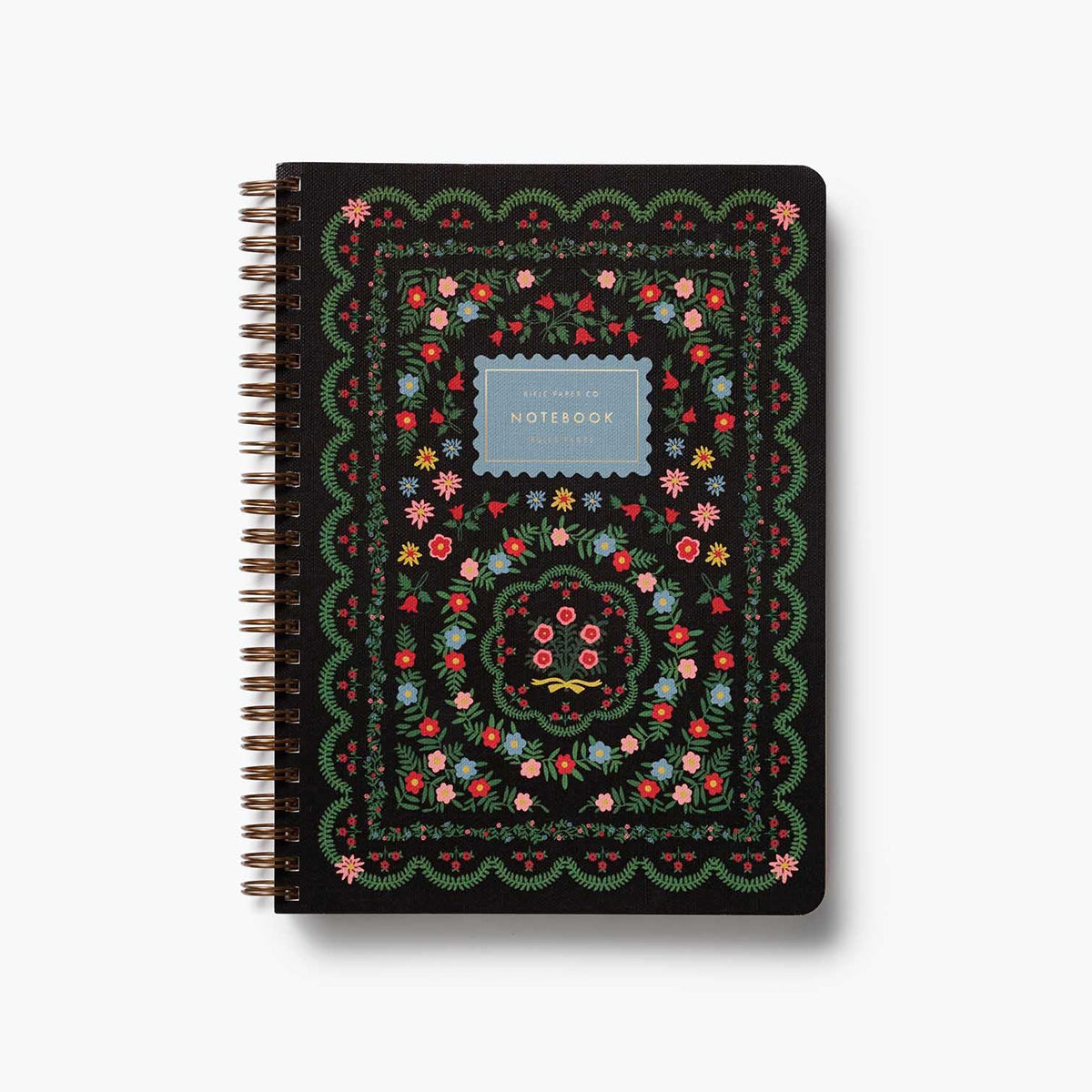 Printed on heavy-weight textured paper, this softcover spiral notebook features an illustrated cover with Rosette florals and gold foil accents. The notebook has 150 ruled, perforated pages, a sturdy double-spiral binding, and pockets for extra storage.