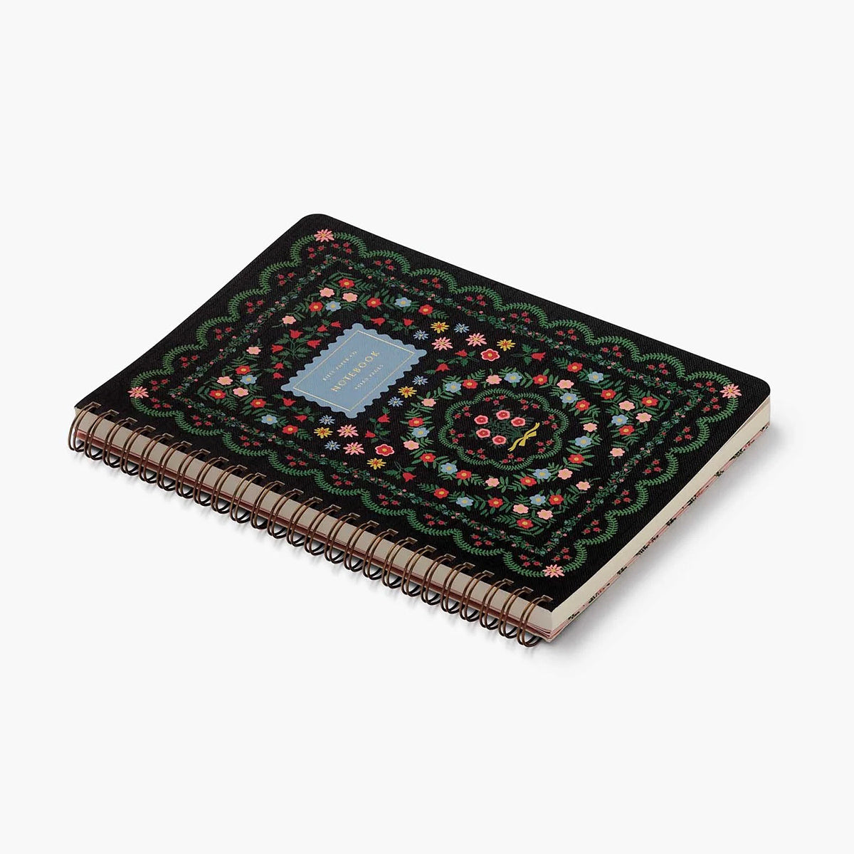 Printed on heavy-weight textured paper, this softcover spiral notebook features an illustrated cover with Rosette florals and gold foil accents. The notebook has 150 ruled, perforated pages, a sturdy double-spiral binding, and pockets for extra storage.