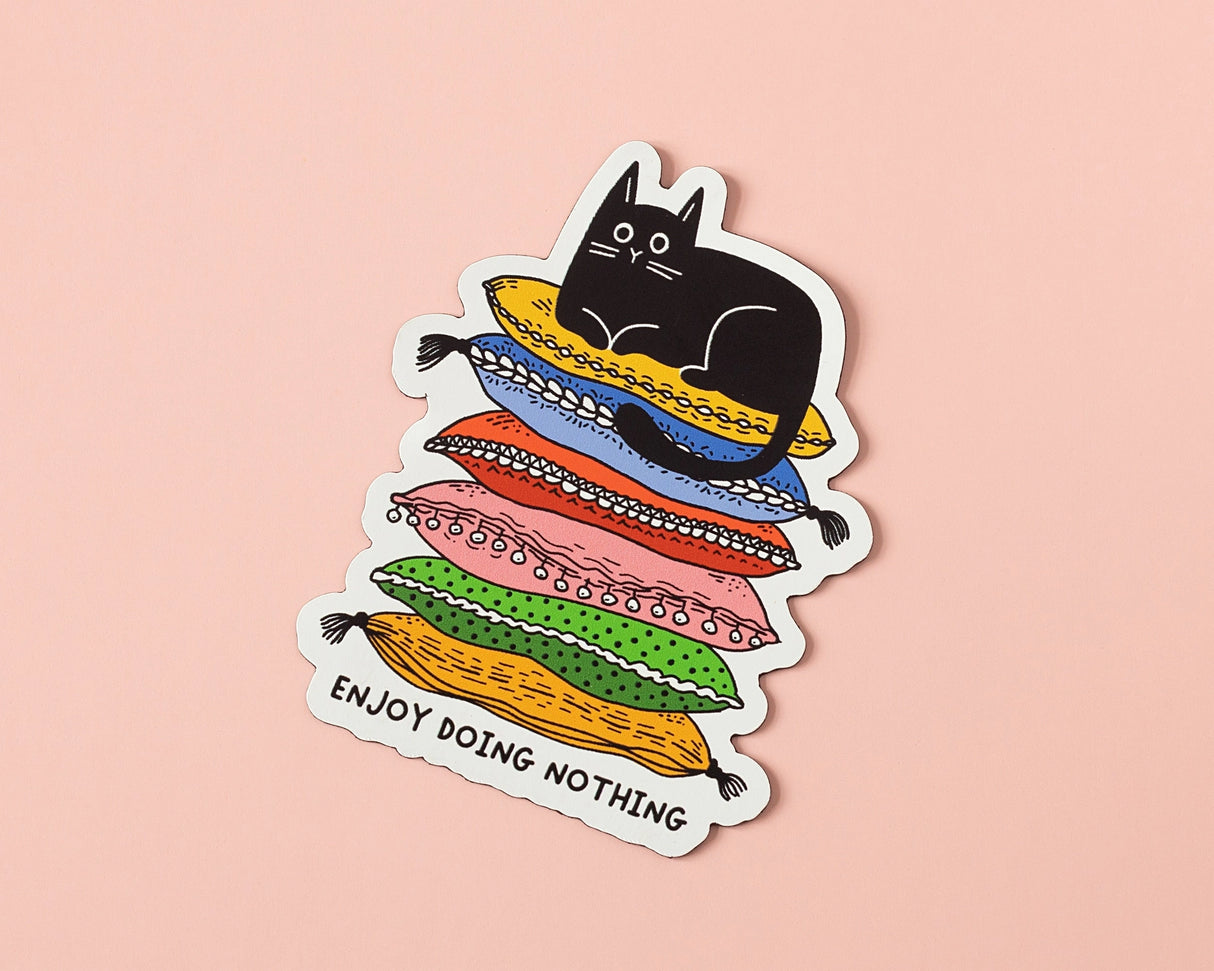 Celebrate rest, laziness, and doing absolutely nothing with this cozy cat vinyl sticker. Featuring a relaxed black cat lounging on a colorful stack of cushions, this playful design is perfect for slow days, quiet moments, and unapologetic chill.
🌟 Key Features:
• Dimensions: 2.34 x 3 inches
• High-quality vinyl material
• Waterproof and weather-resistant
• Ideal for personalizing any surface