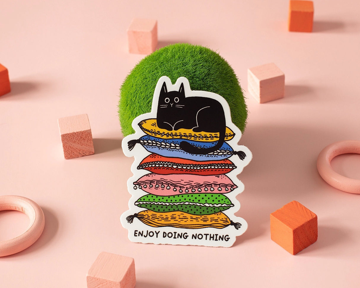 Celebrate rest, laziness, and doing absolutely nothing with this cozy cat vinyl sticker. Featuring a relaxed black cat lounging on a colorful stack of cushions, this playful design is perfect for slow days, quiet moments, and unapologetic chill.
🌟 Key Features:
• Dimensions: 2.34 x 3 inches
• High-quality vinyl material
• Waterproof and weather-resistant
• Ideal for personalizing any surface