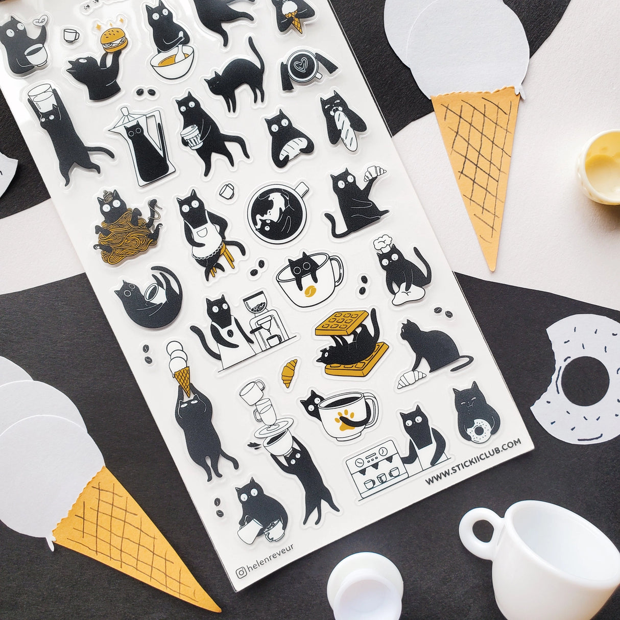 ☕🐈 Chaos is brewing at this tiny cat café! These busy little beans are pouring coffee, stacking waffles, slurping noodles, and sneaking bites between orders. From barista duties to snack-time shenanigans, every kitty is hard at work (or hardly working). Add these mischievous café cats to your pages for a sprinkle of cozy chaos and extra espresso energy.
Top Coating: None
Adhesive Layer: PVC (plastic)
Backing Layer: Clear PET
6.69" x 3.54".
Weight - 0.03lbs.
1 sheet included 