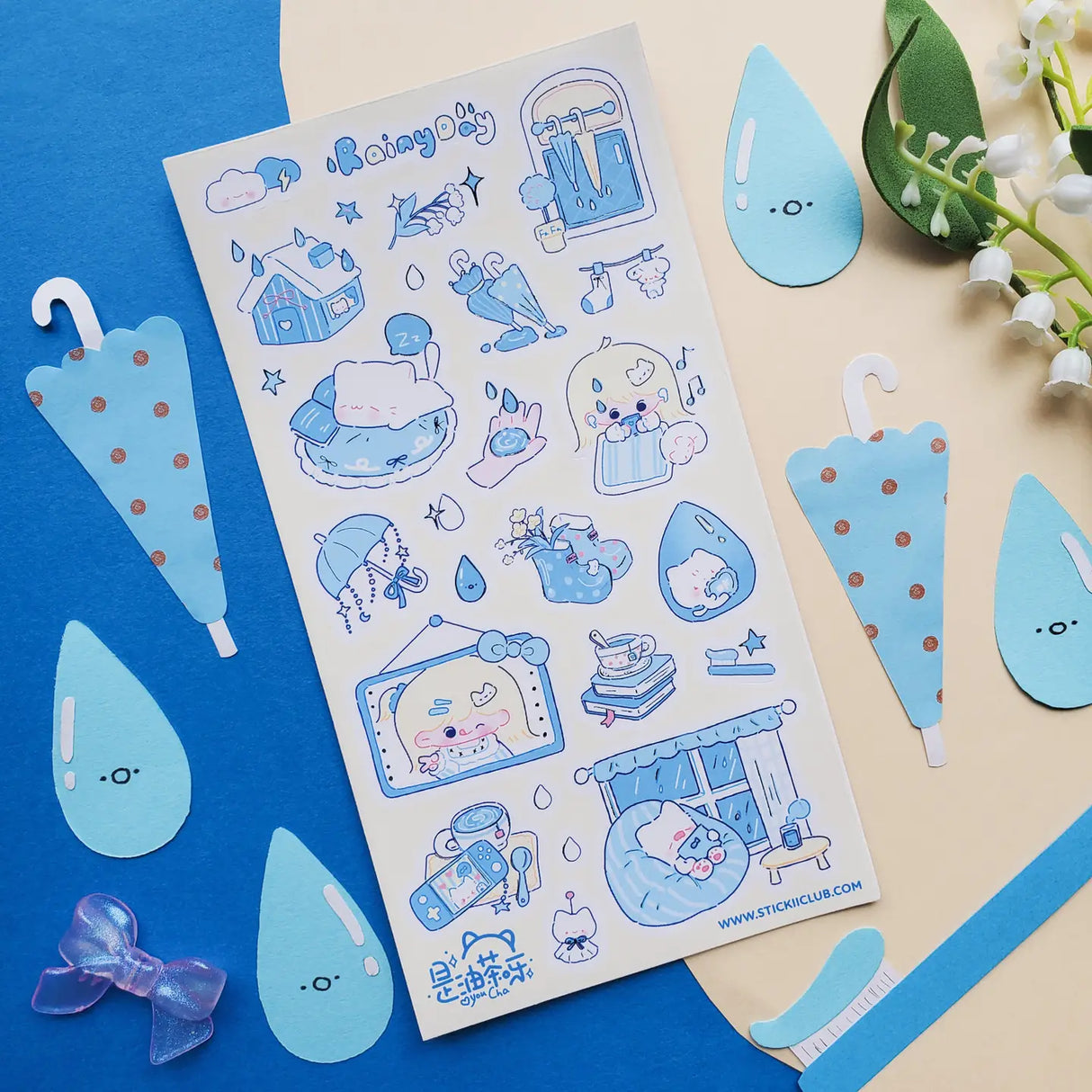 βπ Cozy up and let the rain fall with this soothing blue-toned sheet! Filled with sleepy cats, soft blue umbrellas, rainy windows, warm drinks, and quiet little indoor moments, it captures all the best parts of a slow rainy day. Perfect for anyone who loves the peaceful magic of staying in, getting comfy, and listening to the gentle sound of raindrops outside.