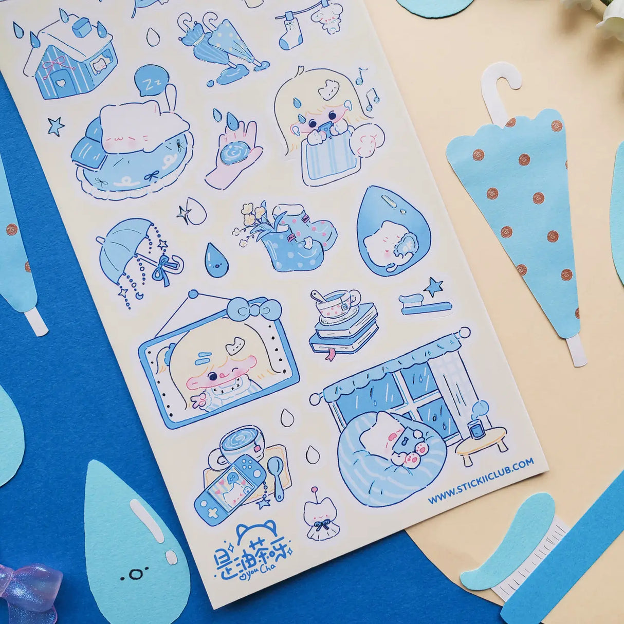 βπ Cozy up and let the rain fall with this soothing blue-toned sheet! Filled with sleepy cats, soft blue umbrellas, rainy windows, warm drinks, and quiet little indoor moments, it captures all the best parts of a slow rainy day. Perfect for anyone who loves the peaceful magic of staying in, getting comfy, and listening to the gentle sound of raindrops outside.