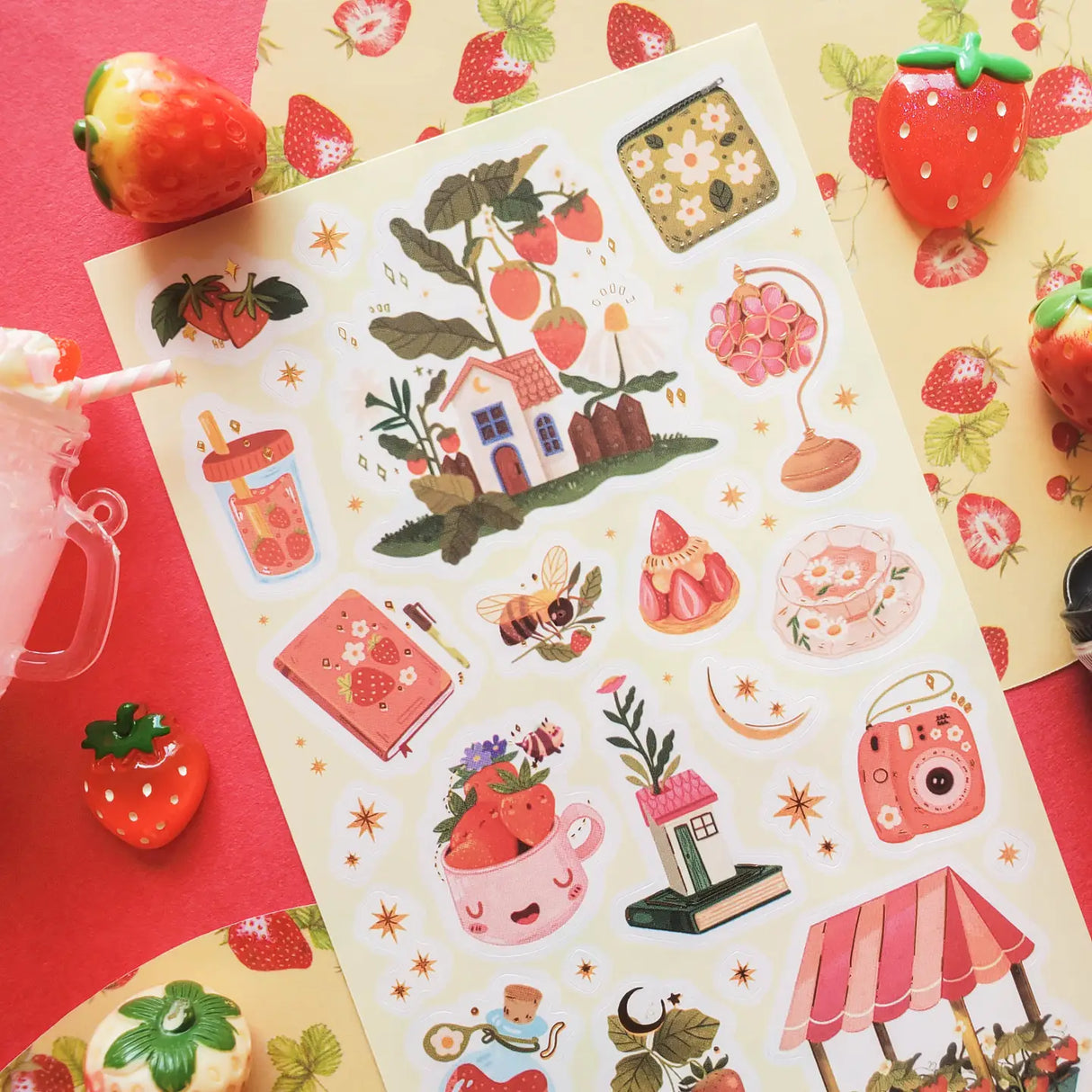 STICKII - Berry Patch Cottage Sticker Sheet
š”š¼ Wander into @karen.illustratorās strawberry-filled set, where tiny houses sit beneath berry-laden branches and sweet treats sparkle under starry skies. Bees buzz between blossoms, teacups overflow with fruit, and little trinkets feel plucked from a magical countryside market. Juicy and whimsical, this charming sheet is bursting with strawberry magic. Art by: @karen.illustrator
Top Coating: Gold Foil
Adhesive Layer: Paper
Backing Layer: Paper
6.69" x 3.54".
