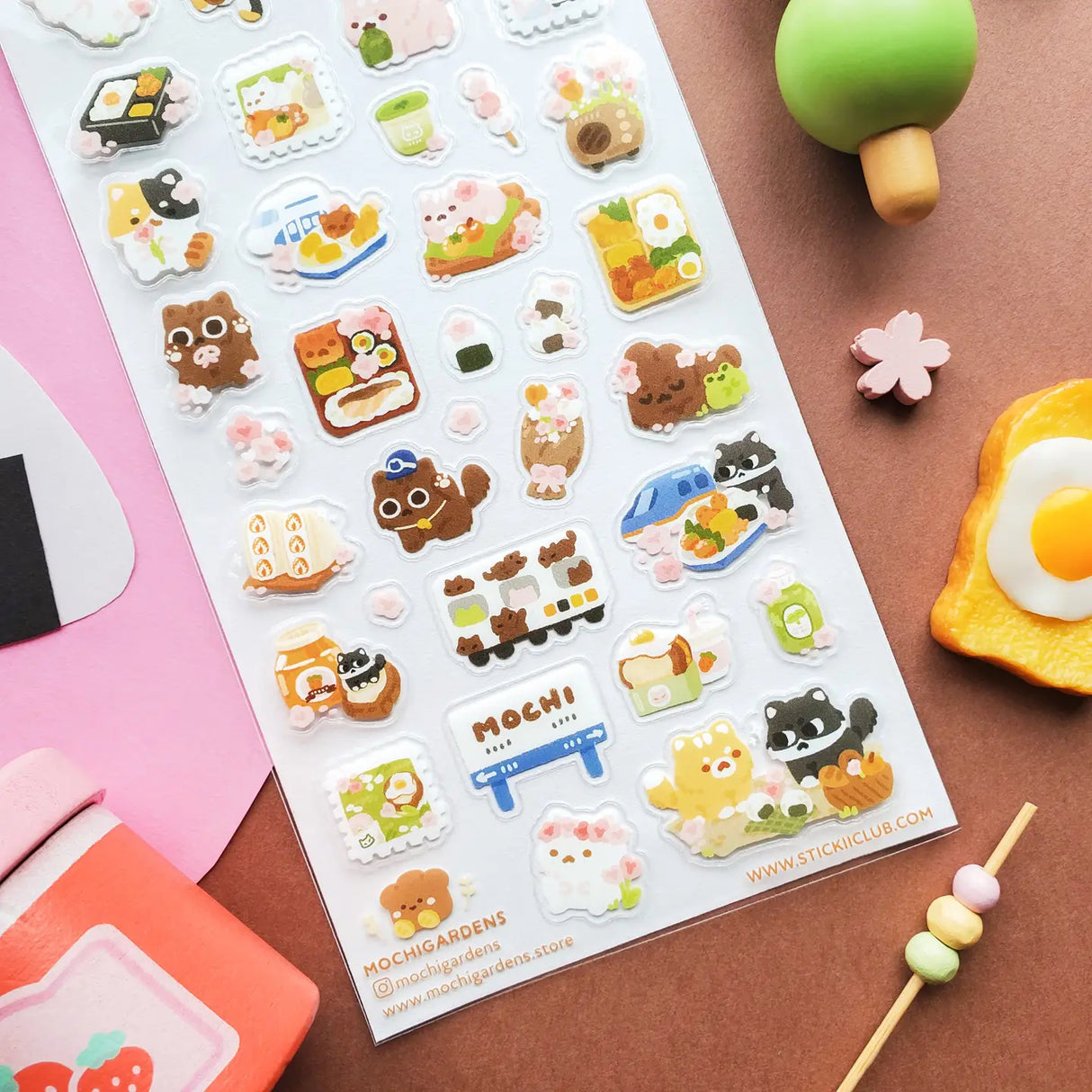 STICKII - Blooming Bento Day Sticker Sheet
🌸🍱 @mochigardens’ sweet kitties are enjoying a dreamy spring picnic in Japan, filled with cherry blossoms, yummy bento boxes, and kawaii snacks at every stop. From rolling through town on little trains to sharing mochi, matcha treats, and beautifully packed lunches, these cuddly kitties know how to savor the season. Art by: @mochigardens
Top Coating: None
Adhesive Layer: Paper
Backing Layer: Paper
6.69" x 3.54".
Weight - 0.03lbs.
1 sheet included 