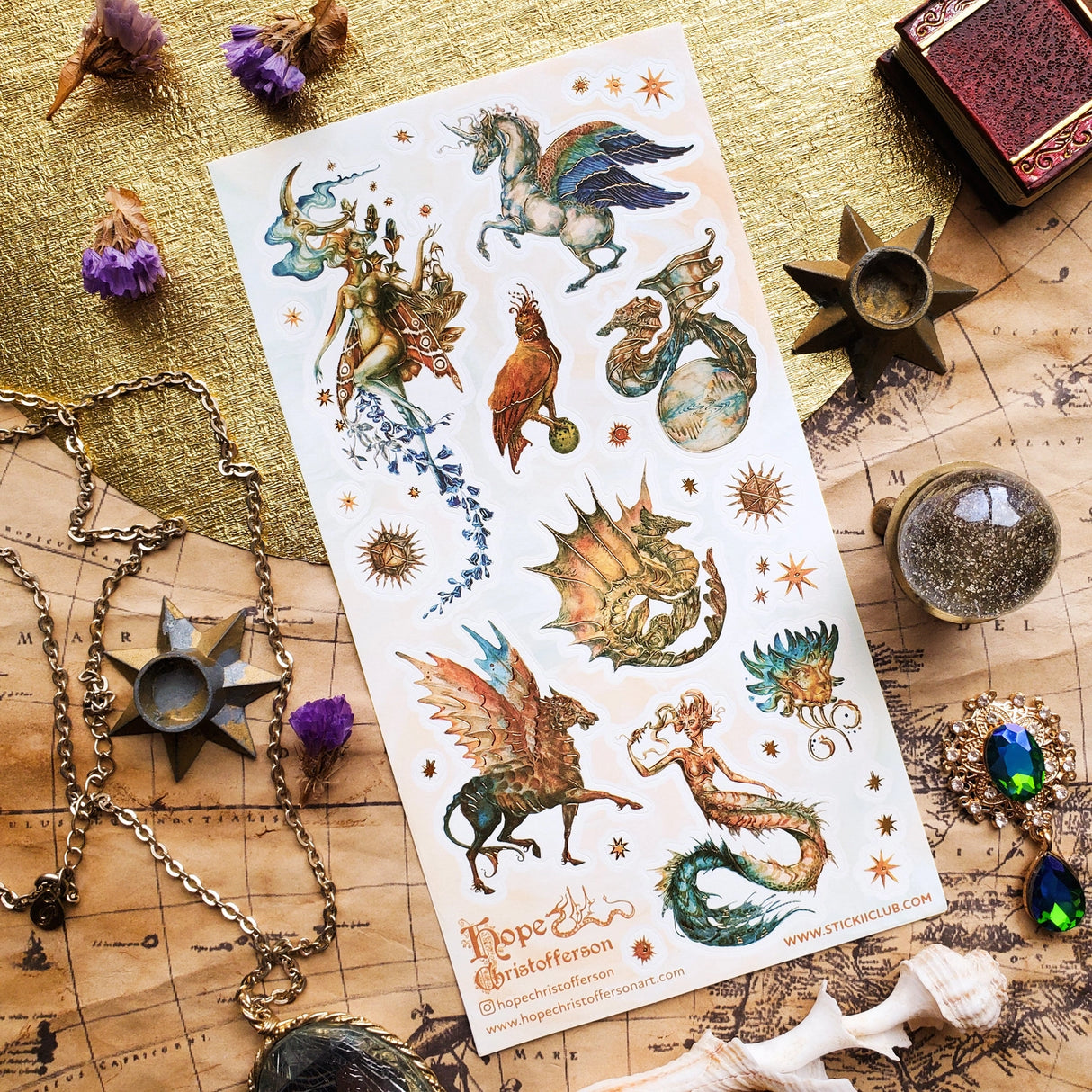 🦄🐉 Soaring through starlit skies and shimmering seas, @hopechristofferson’s mythical beings awaken a realm of untamed magic and ancient wonder. From a winged alicorn and celestial dragons to radiant sirens and cosmic creatures, get ready to weave epic fantasy tales and fill your pages with legendary beauty with this breathtaking sheet.
Art by: @hopechristofferson
Top Coating: Gold Foil
Adhesive Layer: Paper
Backing Layer: Paper
6.69" x 3.54".
Weight - 0.03lbs.
1 sheet included
