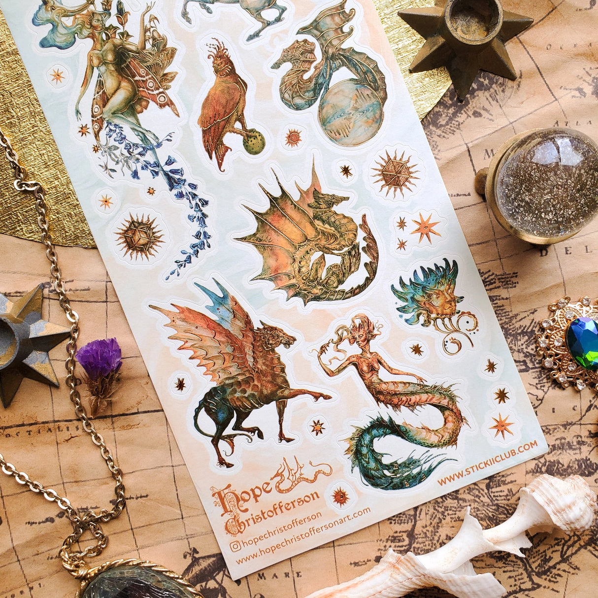 🦄🐉 Soaring through starlit skies and shimmering seas, @hopechristofferson’s mythical beings awaken a realm of untamed magic and ancient wonder. From a winged alicorn and celestial dragons to radiant sirens and cosmic creatures, get ready to weave epic fantasy tales and fill your pages with legendary beauty with this breathtaking sheet.
Art by: @hopechristofferson
Top Coating: Gold Foil
Adhesive Layer: Paper
Backing Layer: Paper
6.69" x 3.54".
Weight - 0.03lbs.