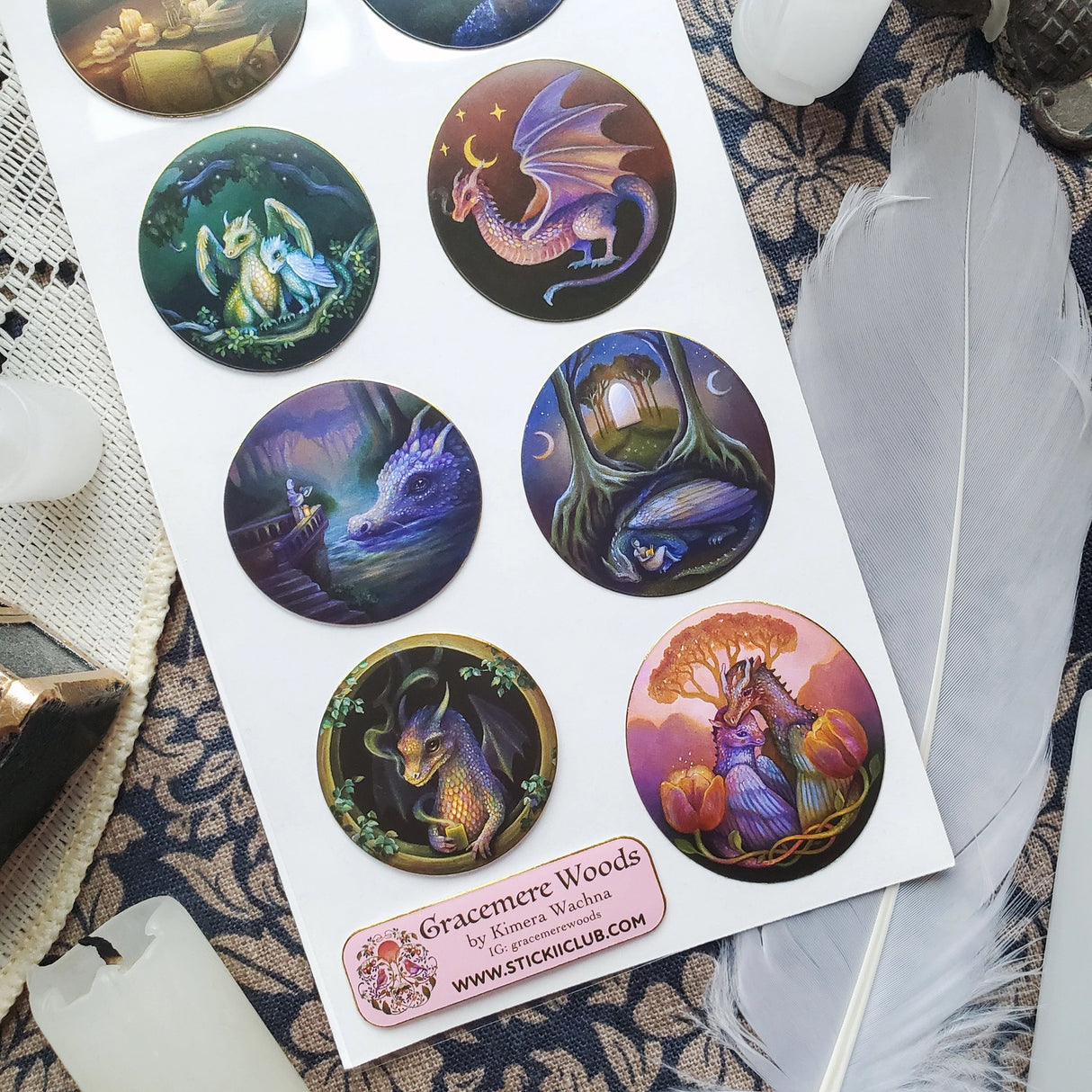 🌙🐲 Bathed in moonlight, @gracemerewoods’ dragons stand watch as gentle guardians of ancient forests, glowing gateways, and sacred firelight. Each scene reveals their role as protectors of balance, beauty, and magic. With dreamy brushwork, luminous atmosphere, and timeless fantasy charm, this sheet brings the legend of these mystical keepers to life.
Art by: @gracemerewoods
Top Coating: Gold Foil
Adhesive Layer: Paper
Backing Layer: Clear PET
6.69" x 3.54".
Weight - 0.03lbs.
1 sheet included
