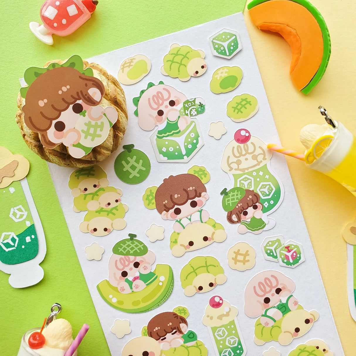 🍈🧃 Craving something delish and refreshing? From bubbly drinks to fluffy buns, look no further than @nao.paperie’s kawaii crew. Packed with fizzy melon sodas, turtle-shaped melonpan, honeydew slices, and the sweetest melon-loving friends.
Art by: @nao.paperie
Top Coating: None
Adhesive Layer: Paper
Backing Layer: Clear PET
6.69" x 3.54".
Weight - 0.03lbs.
1 sheet included 