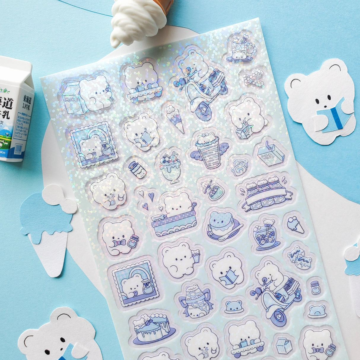 🐻🍰 Get ready for a beary sweet day with this cozy cafe crew! These fluffy bears are serving up smiles, sipping milk, and hustling tasty treats from one adorable moment to the next. From scooter snack deliveries to dessert-filled daydreams, every scene is sprinkled with sugar, warmth, and charm. It’s a treat that’s simply un-bear-ably adorable!
Top Coating: Holo glitter
Adhesive Layer: Paper
Backing Layer: Clear PET
6.69" x 3.54".
Weight - 0.03lbs.
1 sheet included 