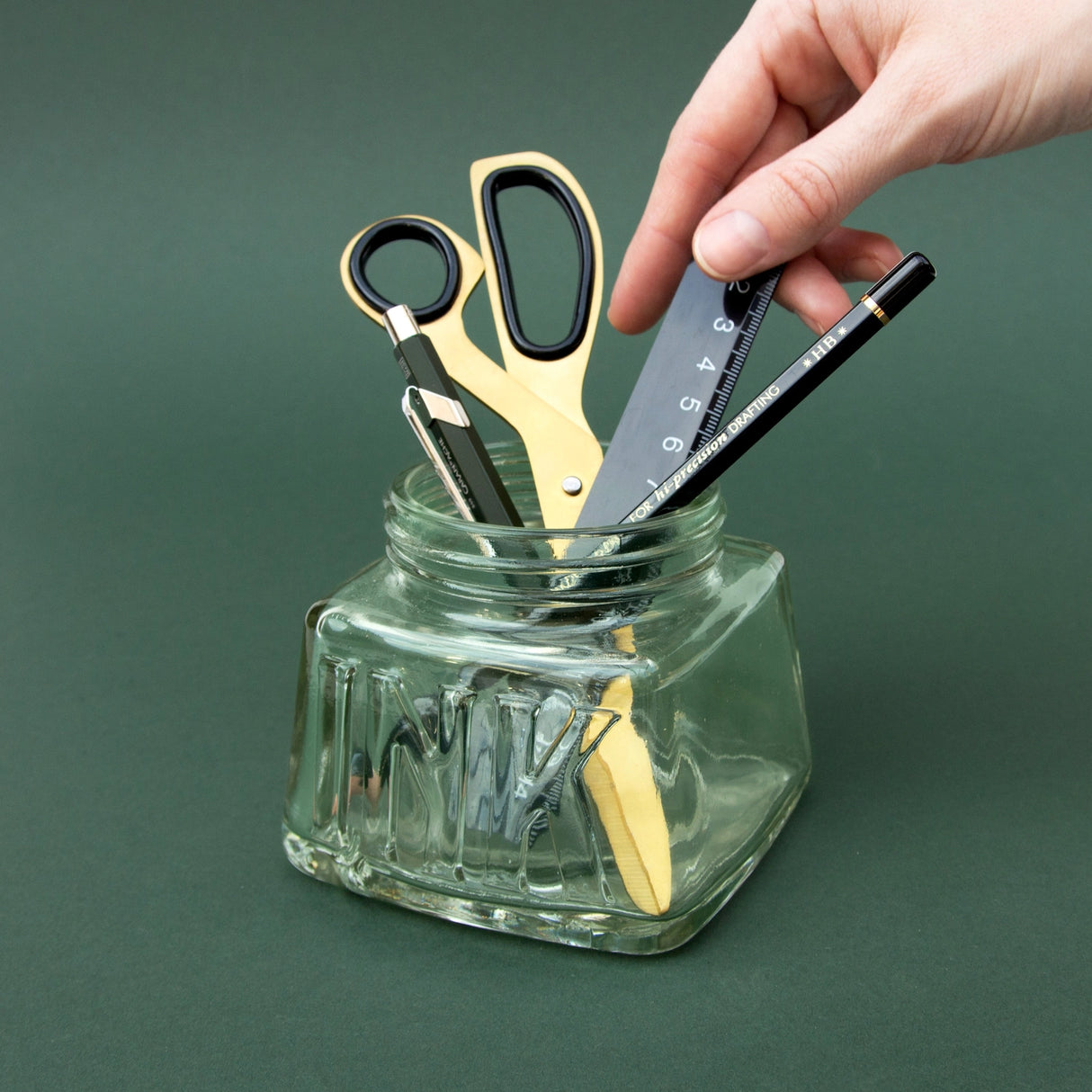 An oversized pen pot designed in the style of a classic inkwell. Made from green-tinted soda glass with plenty of space for your writing tools.
Classic glass pencil pot.
Green tinted soda glass.
Organize your writing tools.
Modern take on a timeless classic.
Pretend you are a Victorian scholar.
Plastic free product and packaging