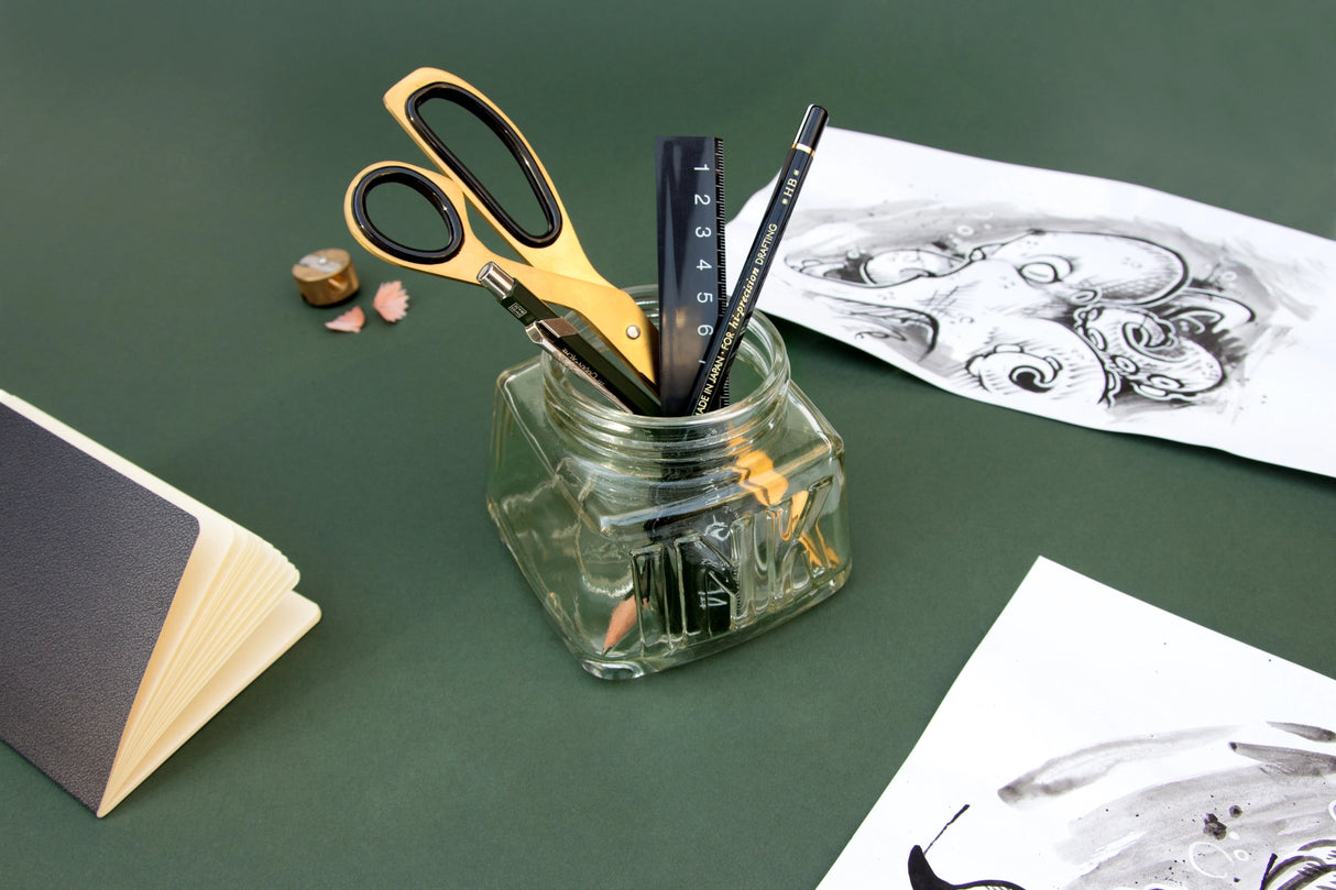 An oversized pen pot designed in the style of a classic inkwell. Made from green-tinted soda glass with plenty of space for your writing tools.
Classic glass pencil pot.
Green tinted soda glass.
Organize your writing tools.
Modern take on a timeless classic.
Pretend you are a Victorian scholar.
Plastic free product and packaging