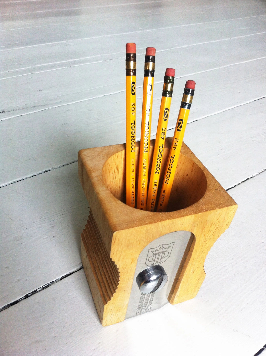 Giant pencil sharpener stationary organizer and pen pot/holder - perfect for organizing your desk at the office, in the classroom or at home. This smart and original product design keeps desks in prime working condition.
Made from extra-strong material: sustainable Rubber wood and silver stainless steel, it’s an elegant and classic design that is instantly recognizable.