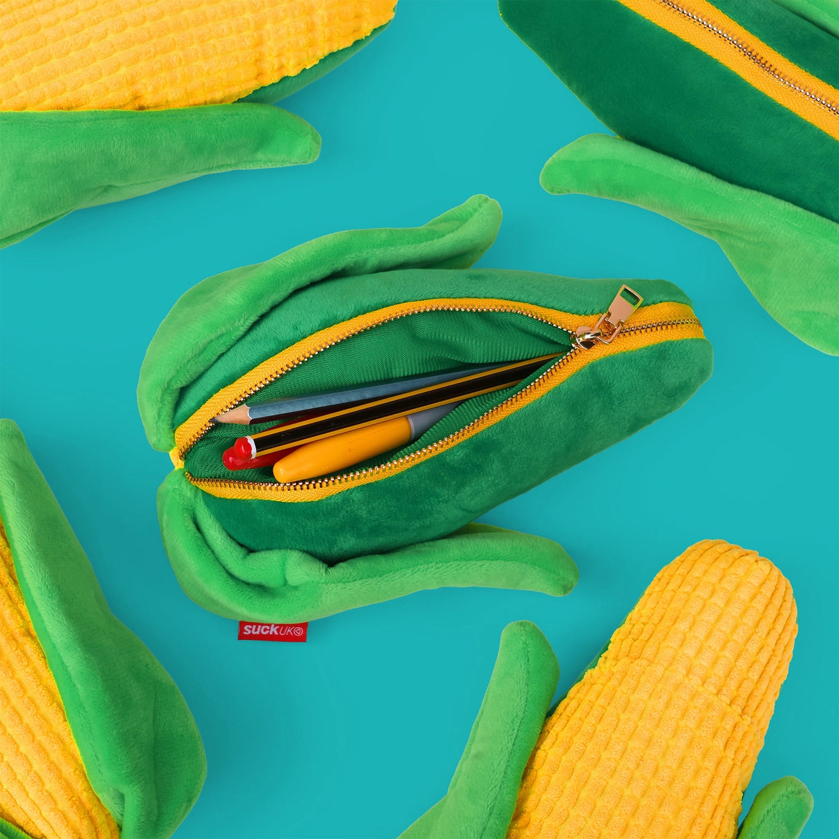 SUCK UK Plush Pouch - Sweetcorn
Plush corn on the cob shaped case with gold zip. Store your belongings in style by filling your corn full. Butter wouldn't melt!
Juicy, tasty, sweet and sour. And very cute. Stuff your stuff into something soft, and squishy. Delicious looking plush zip pouches look like foodie treats but instead of calories, they hold your everyday essentials. Perfect for pens, cables, cosmetics, or whatever bits and bobs you need to stash on the go. Soft-touch plush exterior. Secure zip cl