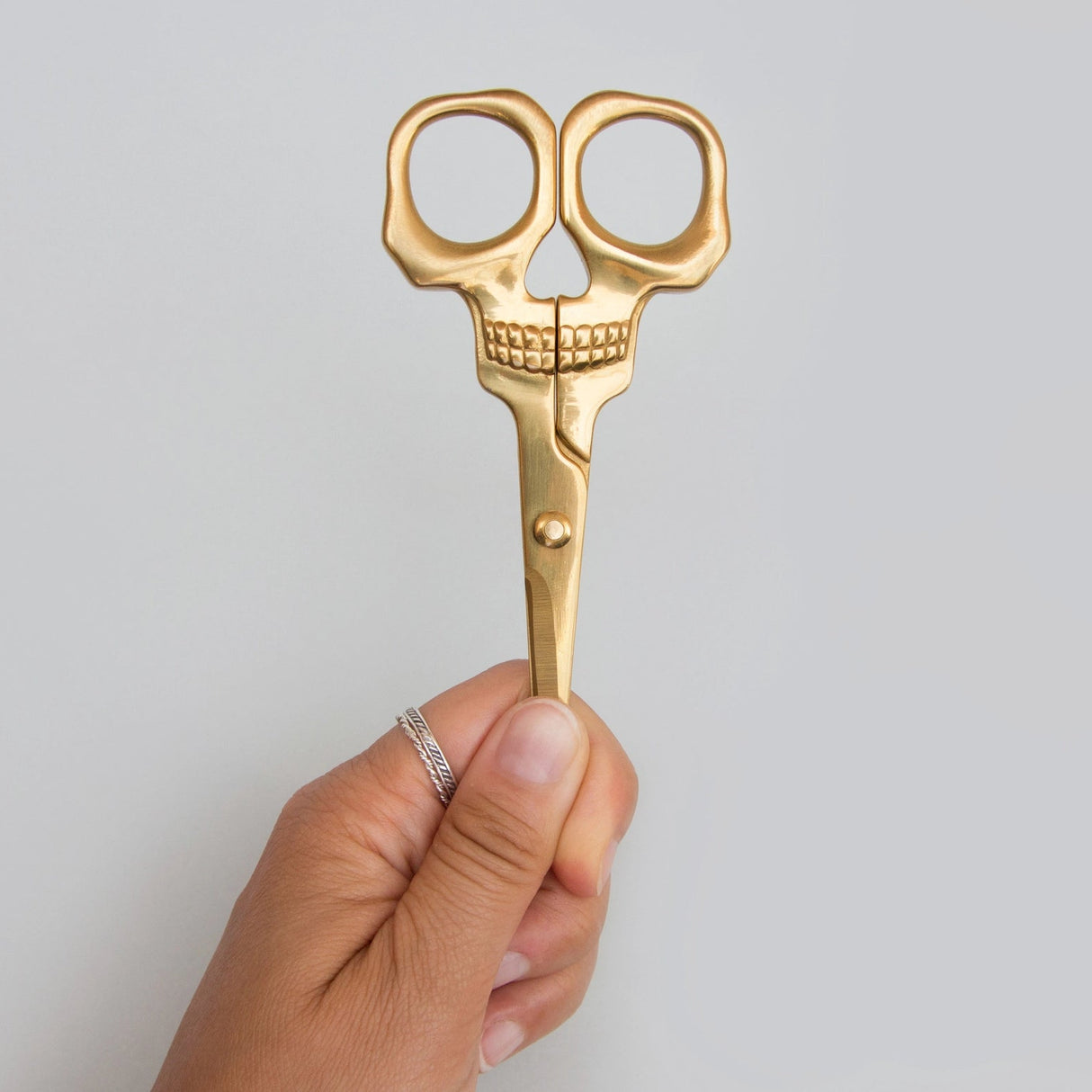 SUCK UK Skull Scissors
Shockingly sharp stainless-steel scissors with a brass finish. From hair-raising haircuts to creepy paper crafts, these heavy-duty general use scissors are both handy and haunting in equal measure. For all eerie everyday tasks, these handy and haunting scissors are tough yet precise. Truly multipurpose, use them to trim your plants, snip your needlework, or even groom your facial hair. Durable stainless steel blades and full metal construction allows them to cut through fabric, paper