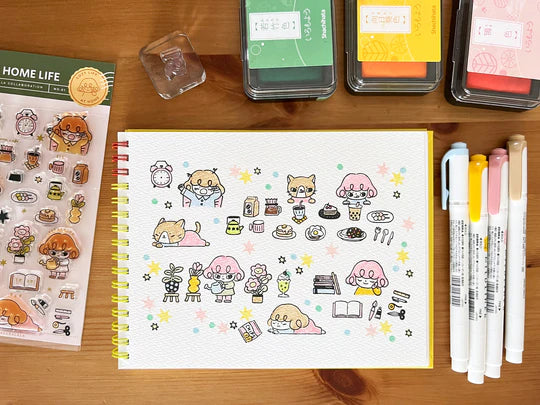 It starts with being woken up by an alarm clock, eating, drinking, watering flowers, enjoying notebook time, reading, and rumbling. Pepper's expression and gestures are very adorable stamps. My partner cat is also cute! It is practical and easy to use as a notebook.
This stamp set is a collaboration between Sakuralala and Love Soup, an Australian artist based in Japan that illustrates pictures of Lazy Girl Pepper. These stamps are the perfect addition for your journal or planner!
