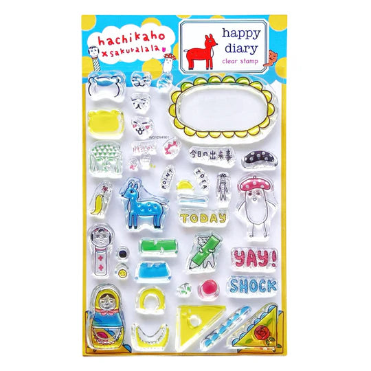 The first collaboration, "happy diary," is a clear stamp set featuring Hachikaho's signature design.
The book is packed with easy-to-use designs and words, as well as plenty of ways to enjoy clear stamps in your own way. hachikaho and Sakurala will be introducing ways to use these clear stamps and ideas on their Instagram, YouTube, and blogs, so please take a look. I hope you'll enjoy some clear stamp time with me!