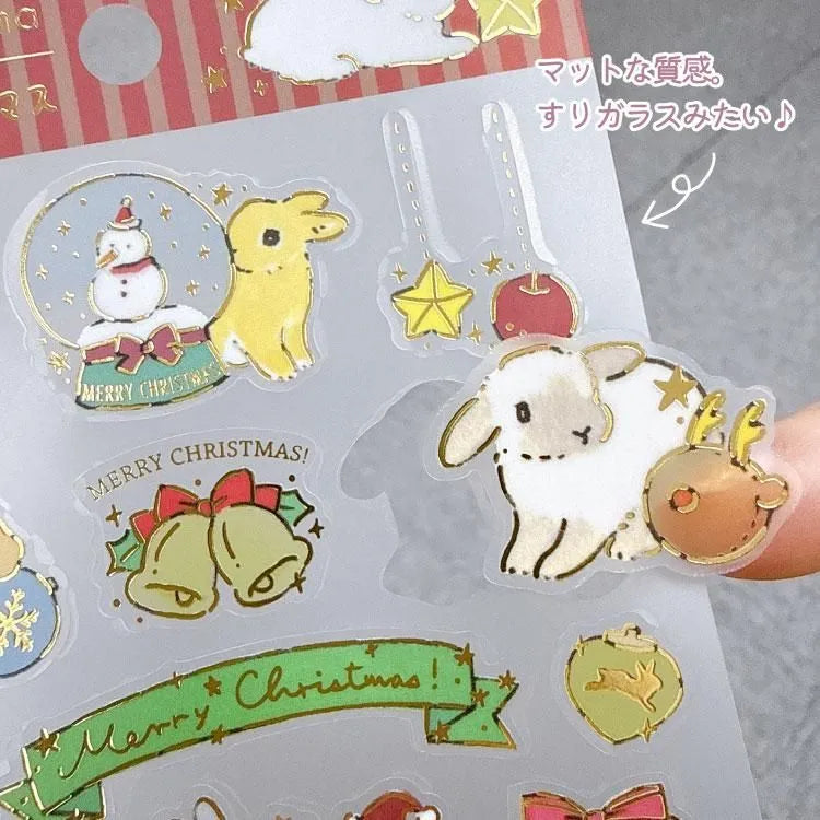 Schinako Moriyama - Christmas Sticker Sheet
Bring the fluffy fun of the holidays into your sticker collection with this sticker sheet! This is a cute sticker made of PET material with a matte coating, offering a cute sheer feel.
Luxuriously decorated with gold leaf and Christmas motifs drawn by the artist, you can enjoy seasonal decorations unique to this season.
Size: 90×195mm
Material: Frosted PET/ Gold Leaf