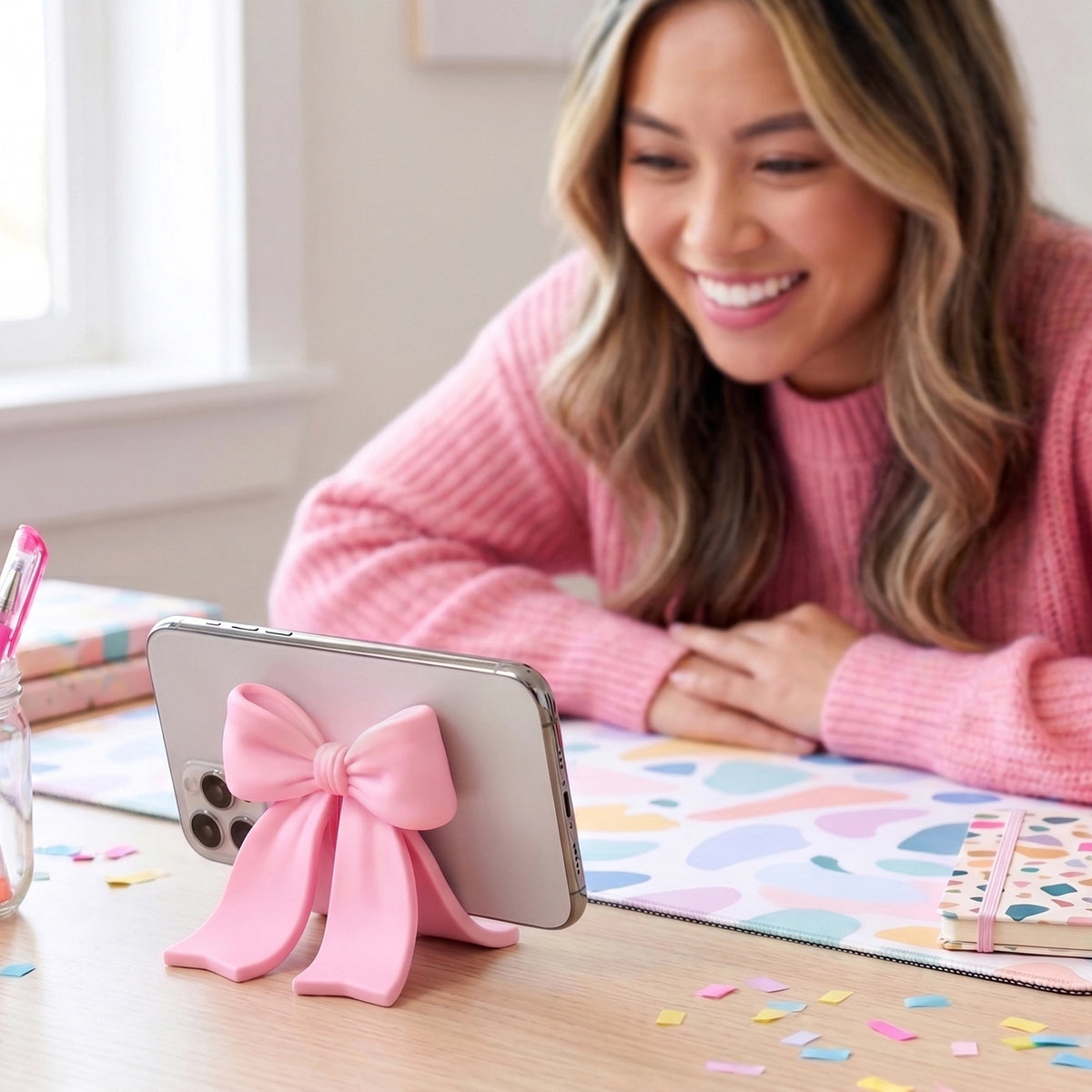 Sitting Pretty Bow Phone Stand
Why settle for a boring stand when you can have your phone Sitting Pretty? Fred’s coquette-inspired phone stand features a cute bow design that’s pretty, pink, and perfectly poised for scrolling, streaming, and staying hands-free. Made from soft-touch rubber, it’s equally fashionable as it is functional.
Measures 2.6" x 2.4" x 2.4"
Design by Winsor Pop, Fred Studio.