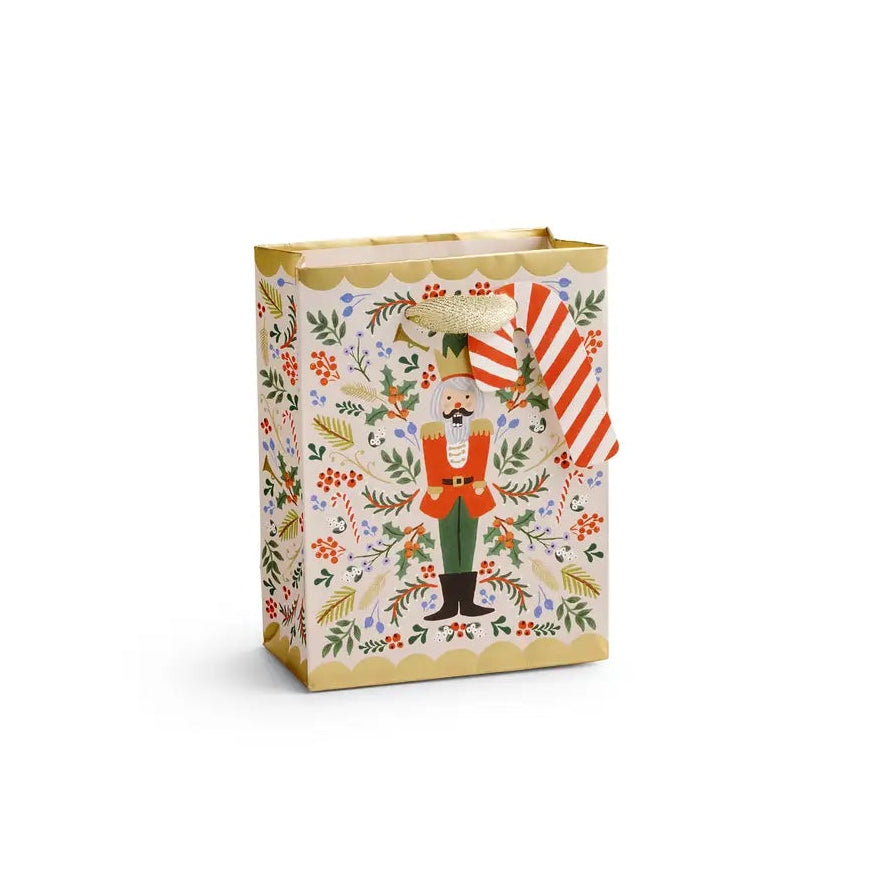 Giving gets even more special with our gift bags, which feature charming extras like gold foil accents, cotton ribbon handles, and a coordinating “To” and “From” tag.
DETAILS
Small: 6" L × 4.5" W
Uncoated paper with cotton ribbon
Printed in full color and foil stamped
Metallic gold foil
Metallic cotton ribbon handles
Cardboard floor insert