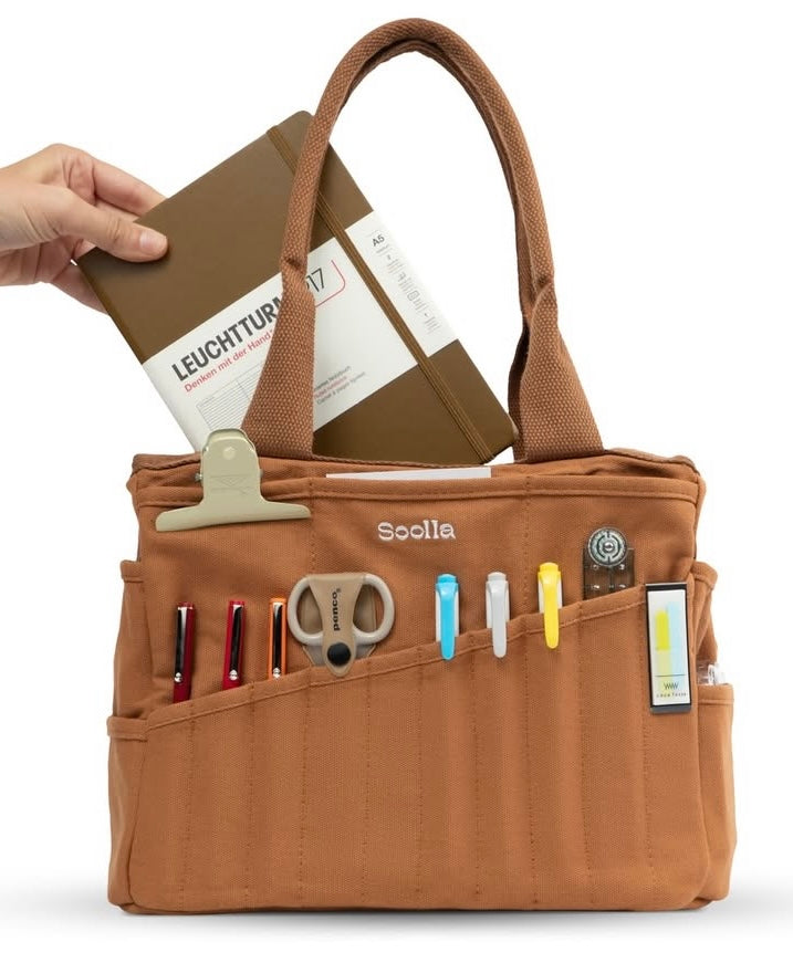 Your art is bold. Your bag should be too. The world's most loved art supply bag, pottery tool bag & knitting project bag – backed by over 10,000 global artists!
✌️ 15 stunning colors ✌️
🌈 Over 30 Pockets Of Varying Sizes
🌈 Slanted Skinny Pockets : For your most-loved tools that beg for your attention (carving tools, knitting needles, crochet hooks
🌈 Large Interior Storage + 2 interior pockets: Perfect for carrying glazes, knitting yarn, crochet supplies, and craft supplies
🌈 Phone & Wa