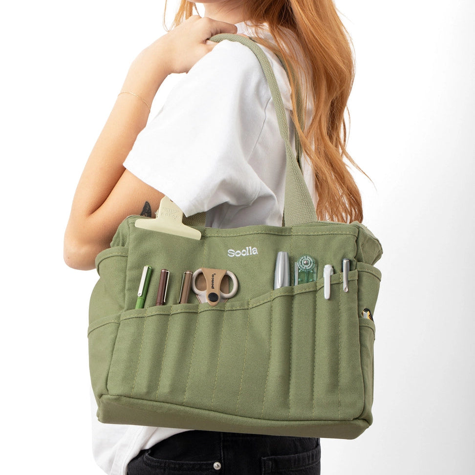 Your art is bold. Your bag should be too. The world's most loved art supply bag, pottery tool bag & knitting project bag – backed by over 10,000 global artists!
✌️ 15 stunning colors ✌️
🌈 Over 30 Pockets Of Varying Sizes
🌈 Slanted Skinny Pockets : For your most-loved tools that beg for your attention (carving tools, knitting needles, crochet hooks
🌈 Large Interior Storage + 2 interior pockets: Perfect for carrying glazes, knitting yarn, crochet supplies, and craft supplies
🌈 Phone & Wa