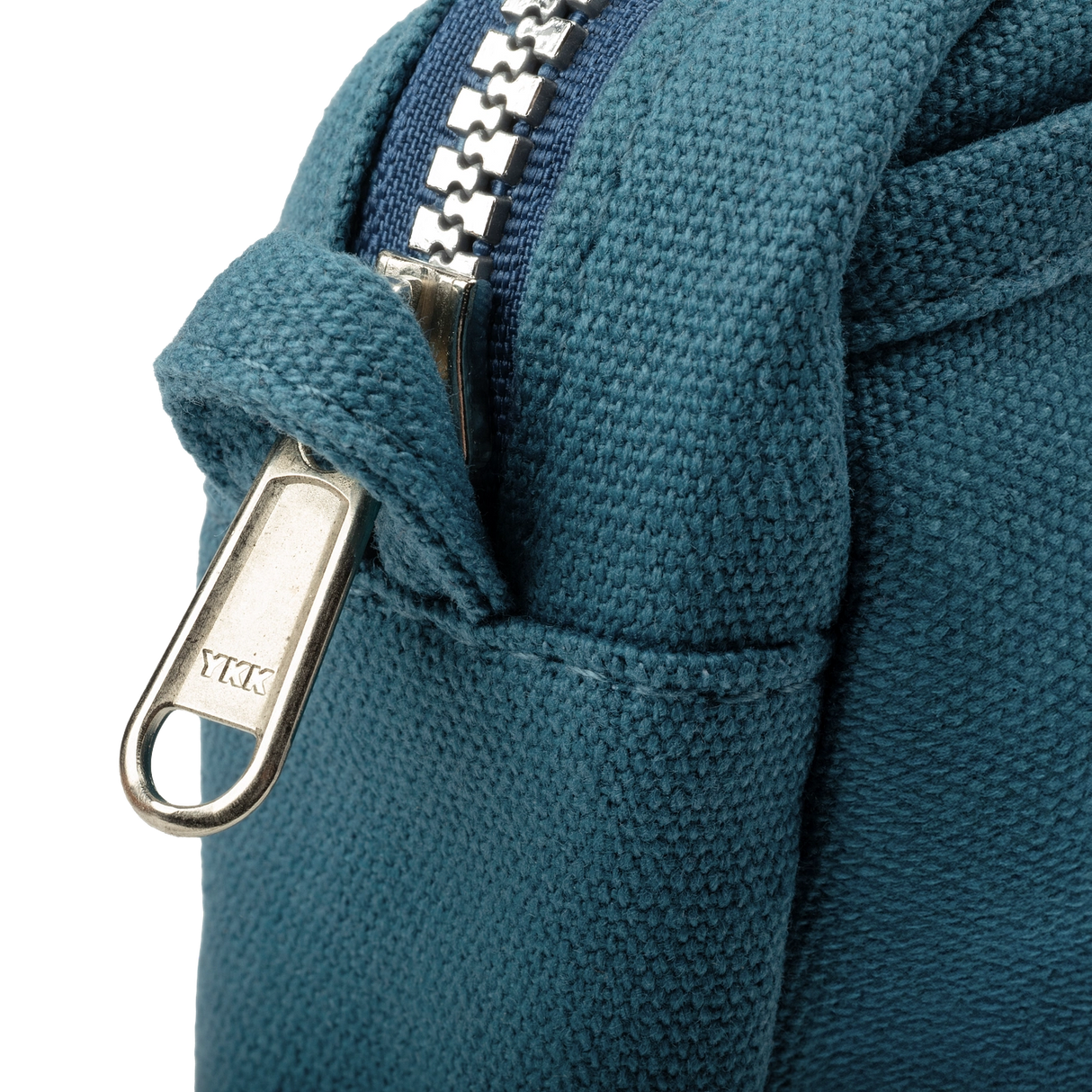 Front layout: 8 slanted pockets + 3 directly behind
Interior: Main compartment fits an A5 notebook; two open compartments on each wall
Back panel: 3 wide exterior pockets + one full-length slip pocket
Quick-drying duck canvas — sturdy, breathable, and machine-washable
Convertible design — hooks for your own strap or a Soolla strap (coming soon)
Structured silhouette — holds its shape even when lightly packed
Full-width YKK zipper — smooth and durable
Compact profile — fits inside larger bags or