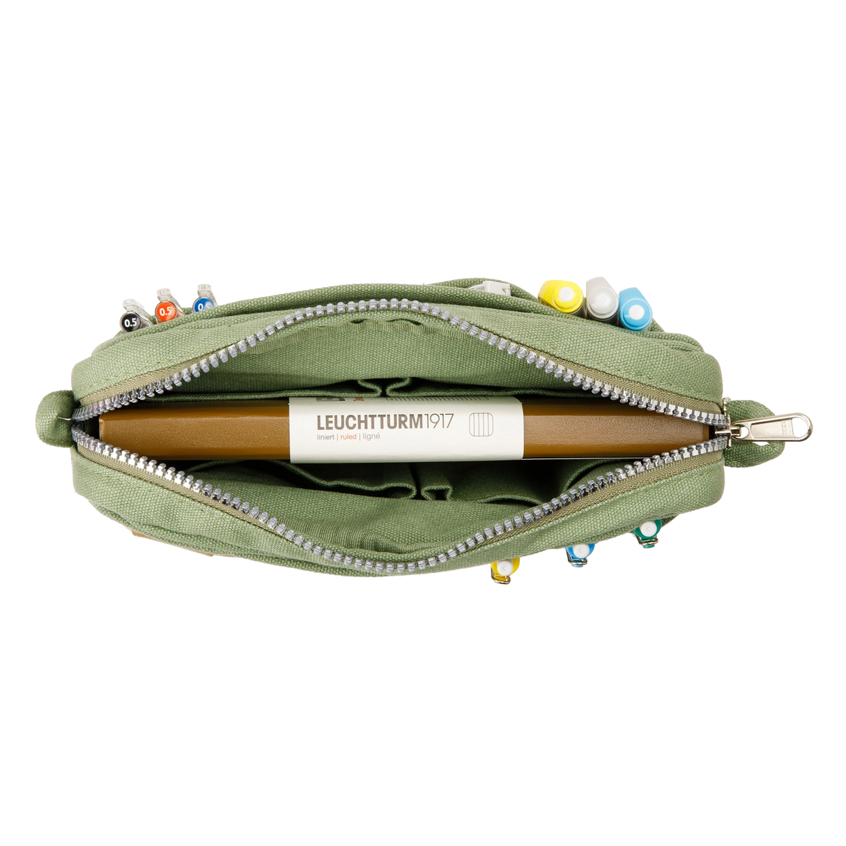 A compact carry-all pouch for artists, makers, and stationary lovers who appreciate a little order in their chaos. Structured enough to hold its form, soft enough to fit anywhere, and fully machine-washable for the days that get a little messy — your tools, pens, and creative essentials stay safe, visible, and ready wherever you go.
Inside, 20 pockets make space for art supplies, stationary essentials, and an A5 notebook, all secured by a smooth YKK zipper. Sized to fit within larger bags or carry on its o