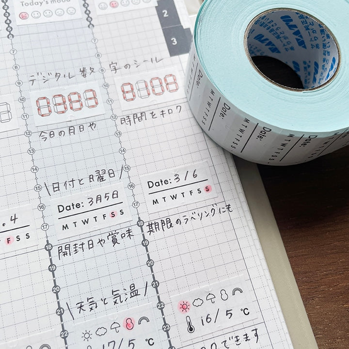 Stamp Marche Planner Label Sticker Roll - Date and Days of the Week Roll of date labels on a planner with Japanese text
