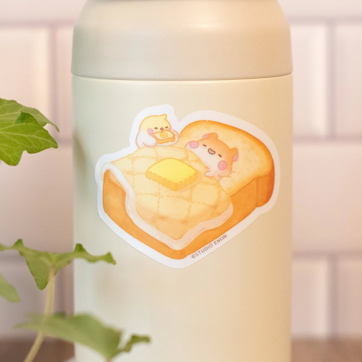 Muffinmaru about to enjoy a nice breakfast in bed that Devyegg prepared for him. The best way to start your day is with some toasty bread. The matte coating on this sticker gives it a premium soft touch and the backing paper is cut for an easy peeling experience.
Dimensions: 2.5” x 1.8” (6.3cm x 4.7cm)
Material: PP
Waterproof