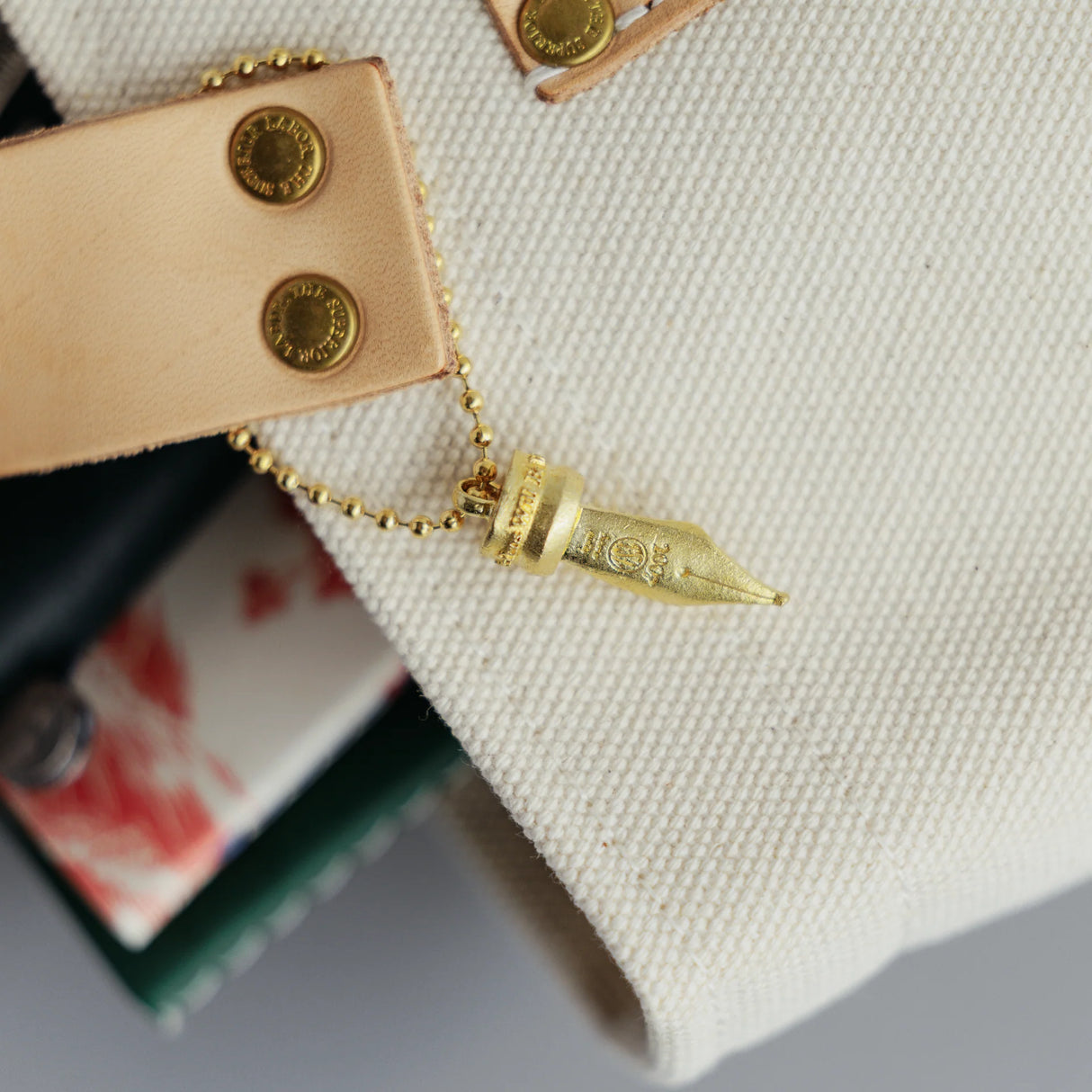 A Fountain Pen Nib Charm: Carried with Meaning
A solid brass charm meticulously shaped in the likeness of a classic fountain pen nib. Every intricate detail is beautifully captured, complete with the inspiring engraved message, "The Pens Will Be With You Always."
Equipped with a sleek ball chain, it attaches effortlessly to your bags, pouches, or key rings. Despite its petite size, it brings the distinct, rich texture and unmistakable presence that only genuine brass can provide.
As you use it, the brass