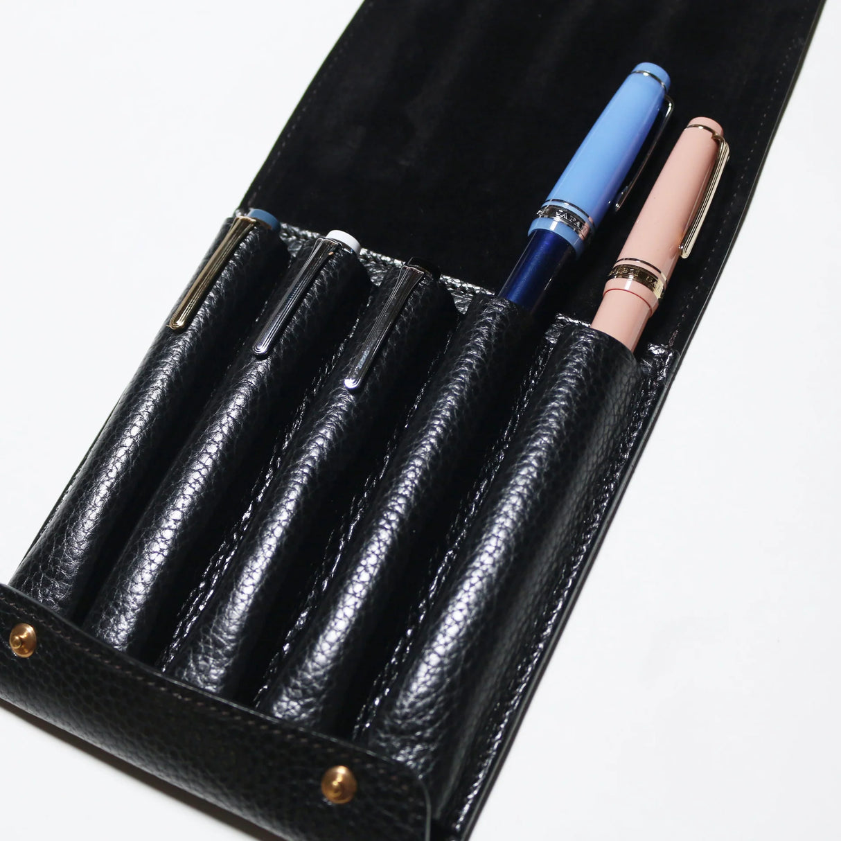 This case for fountain pens can hold five pens individually.
Lined with pig suede for a luxurious look and feel, your precious pens will be well protected and carried.
The buttons are original, made of solid brass and stamped with T.S.L.
SIZE: L13cm × H15cm
COLOR: Camel / Brown / Black
MATERIAL : Cow leather
Leather Products:
The leather used in this product is natural leather.
We do not use scratches that lead to tears or rips, but we use scratches and wrinkles that are originally