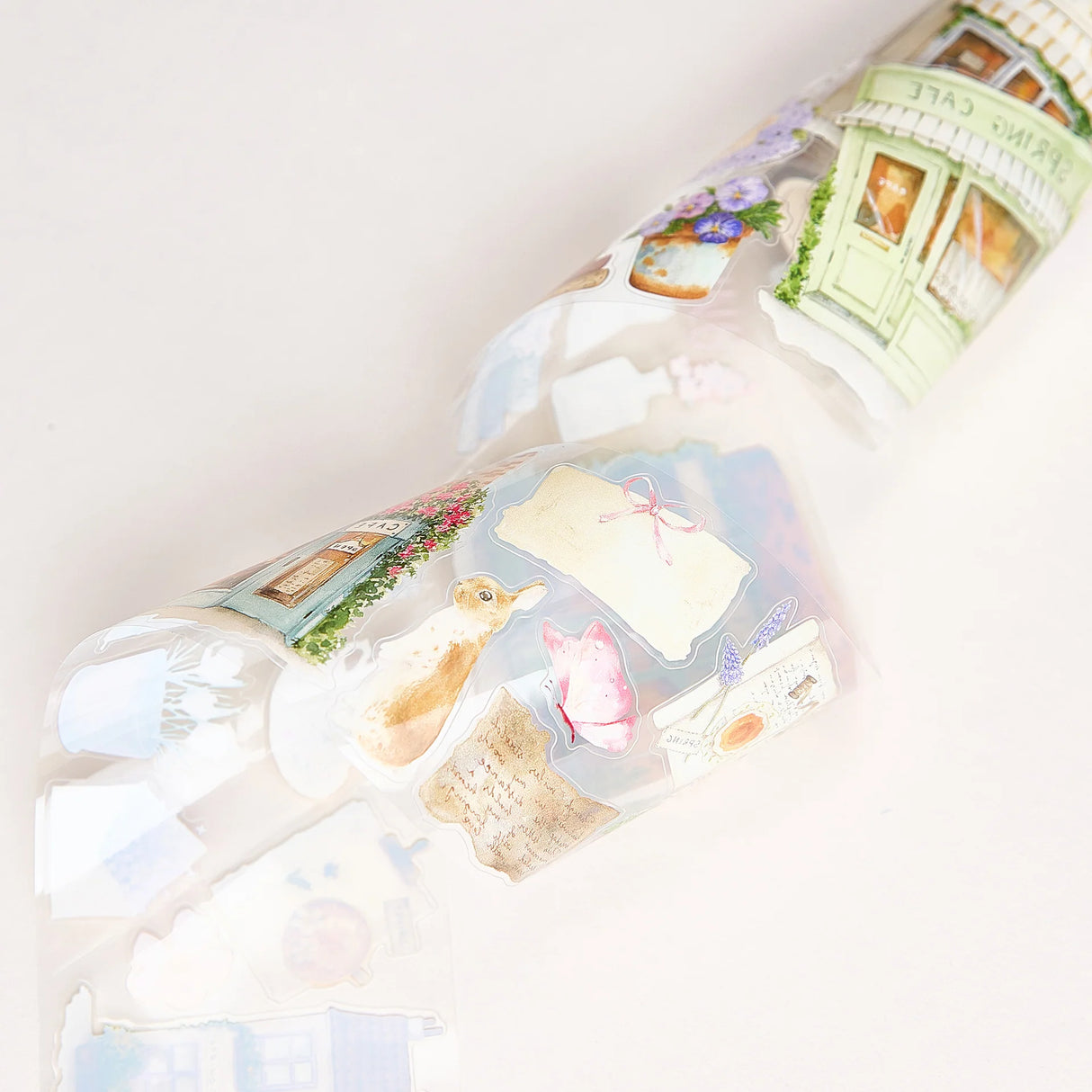 Celebrate the season of new beginnings with a design that marries architecture and nature. Our Spring Café Wide Tape is a watercolor love letter to the season, featuring quaint cafe facades almost hidden behind explosions of pastel bouquets and greenery.