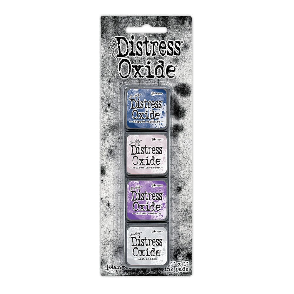 Tim Holtz Distress Mini Oxide Ink Pads are a collection of 1 x 1 cubes featuring water-reactive dye & pigment ink fusion that creates an oxidized effect when sprayed with water.