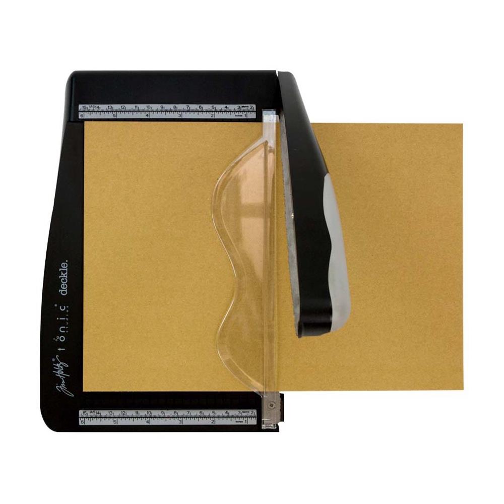 The Tim Holtz Deckle Torn Edge Trimmer gives your projects the perfect distressed deckle edge effect with maximum control and precision. Designed to provide effortlessly repeatable deckle effects, this new cutting tool from Tim Holtz and Tonic Studios is essential for any crafter looking to bring life to their next design. Combine with different papers and card stock for varying torn edge effects.