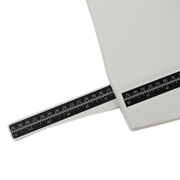 Featuring a geared rotary cutting blade, this trimmer effortlessly cuts through a range of crafting mediums. The trimmer offers both imperial and metric rulers, as well as a handy 0.25 inch gridded base with popular paper sizes for ease of use. With a compact base that has a cutting length of 12.5 inch/31.5cm and extendable arms that can expand it to 12 inch/30.5cm, this trimmer is both versatile and practical.