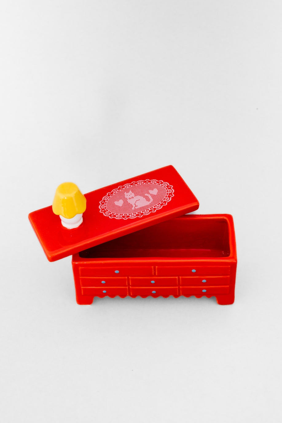 Put your trinkets in this tiny dresser with this tiny little lamp on top. You’ll feel like a doll in the tiniest little doll house. Trust us, we’ve tried it. Highly recommend. 
