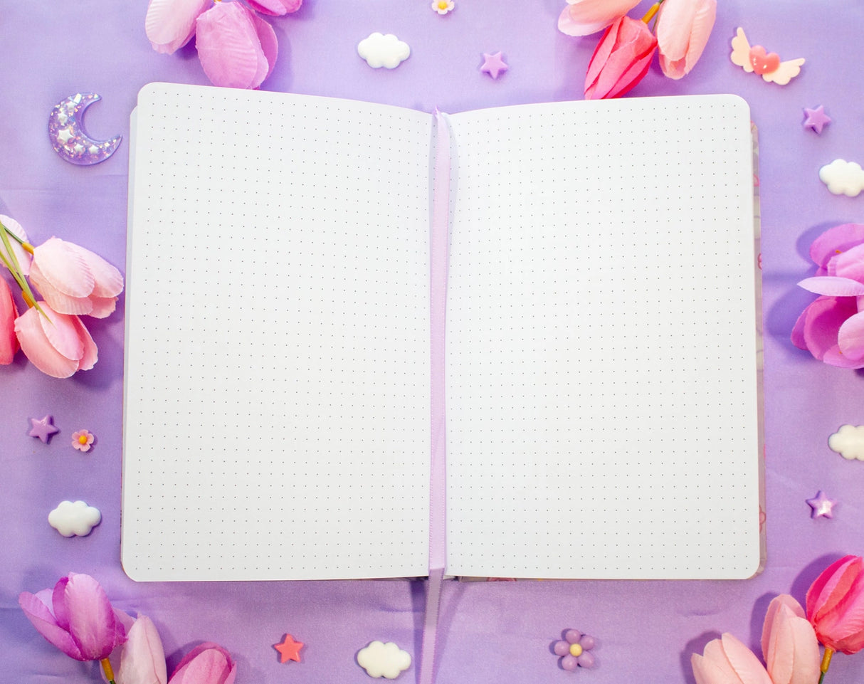 Unicorn Eclipse - Pastel Academia Dotted Journal
✧Size & Materials✧
Size: A5 (approximately 5.8 x 8.3 inches)
Smooth hardcover, rounded corners
160 dot grid pages, 140 gsm
Includes ribbon bookmark, elastic band, and back pocket