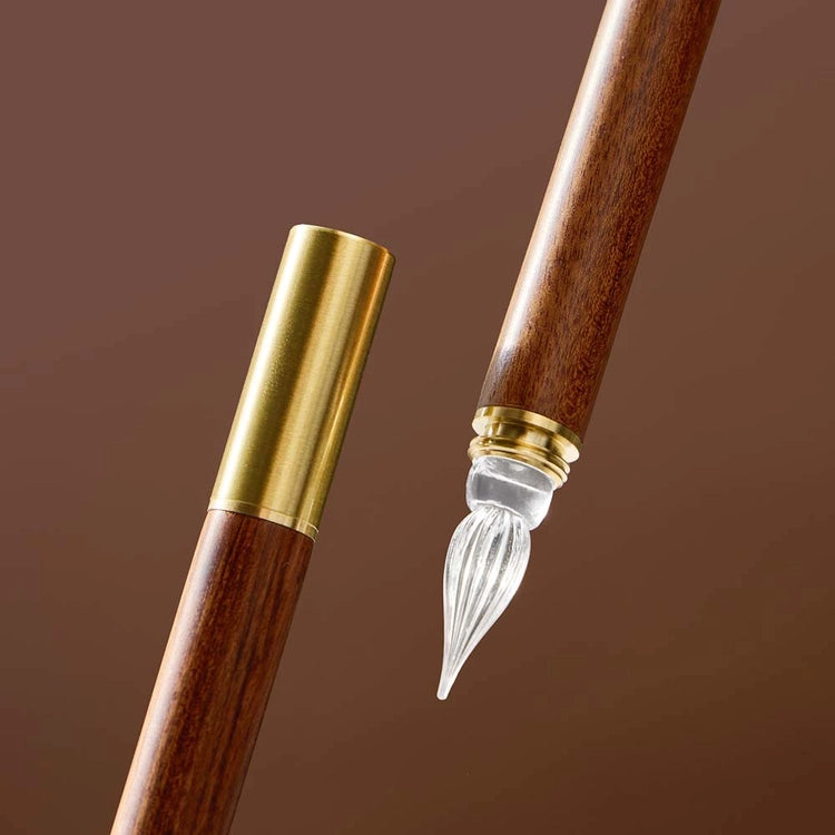 A modular glass pen that combines a glass nib with an elegant rosewood body.
The modular design allows the pen to be used for many years to come due to its easy nib replacement system. Designed to be easy to use and clean, the nib can be detached easily and lightly rinsed with water for cleaning.
The screw on brass cap allows for safe transport and storage making it perfect for use on the go. 