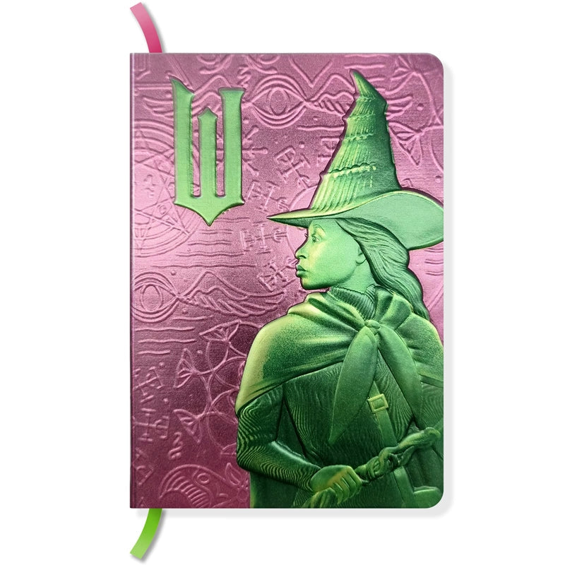 The perfect place to note your thoughts in style, this 184-page collectible journal is a stylish gift for any Wicked fan. This reversible journal can be flipped to present either Elphaba Thropp’s or Glinda Upland’s profiles, with internal pages in soft shades of green and pink and with a satin placeholder ribbon.
QUALITY CONSTRUCTION: This journal features a stunningly detailed, molded hardcover with metallic finish, 184-ruled pages of premium paper, plus a satin ribbon marker to ensure you never lose your
