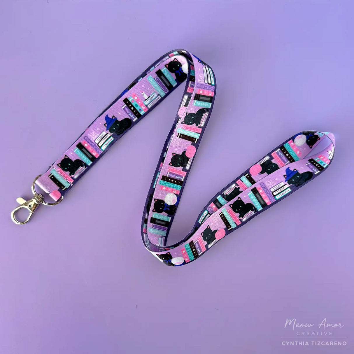 Bookish Witch Cat Lanyard. This purple lanyard features witch cats and books, perfect for all cat lovers out there. Show off your love for felines while keeping your items secure and easily accessible.
2cm X 95cm
double-sided printing
Swiveling Lobster Clasp